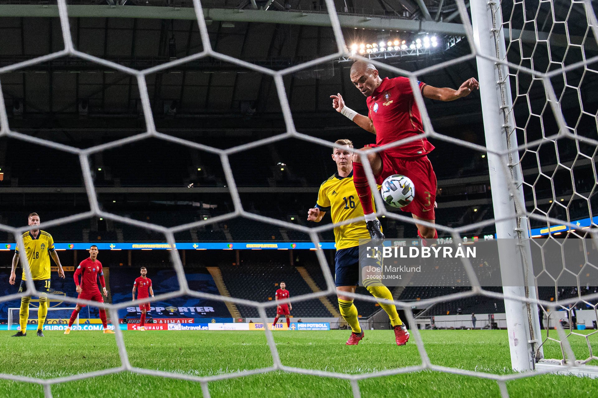 Emil Krafth of Sweden sees Pepe of Portugal miss a scoring