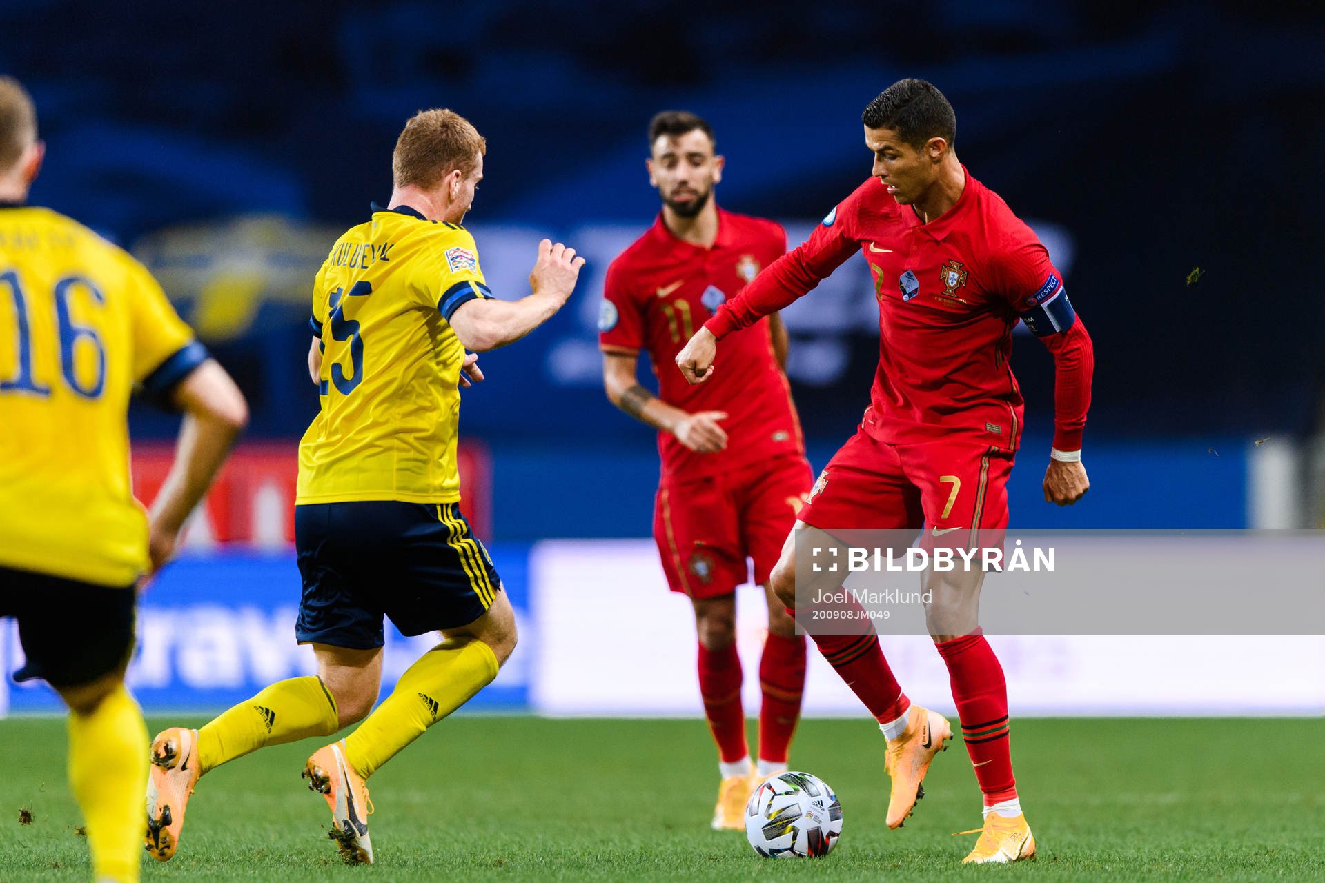 Dejan Kulusevski of Sweden and Cristiano Ronaldo of Portugal
