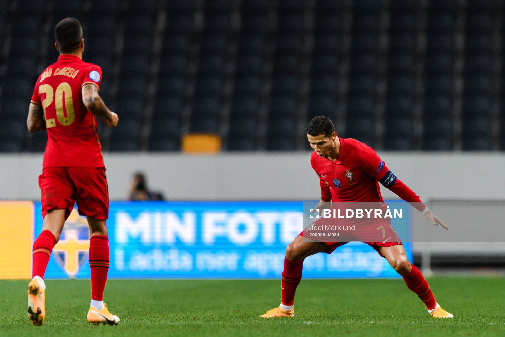 Joao Cancelo and Cristiano Ronaldo of Portugal celebrate
