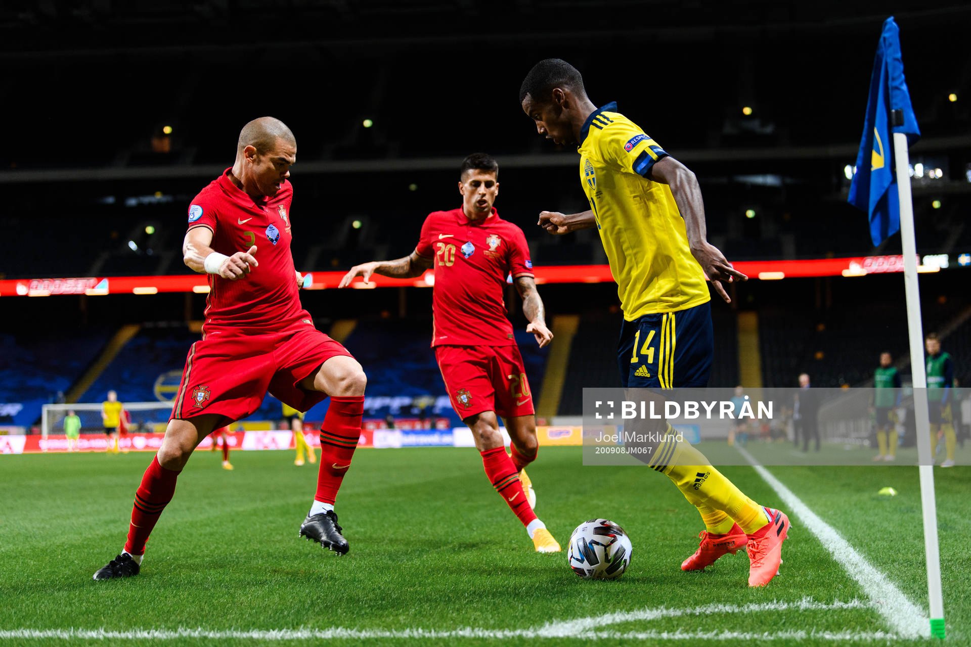 Pepe and Joao Cancelo of Portugal against Alexander Isak of