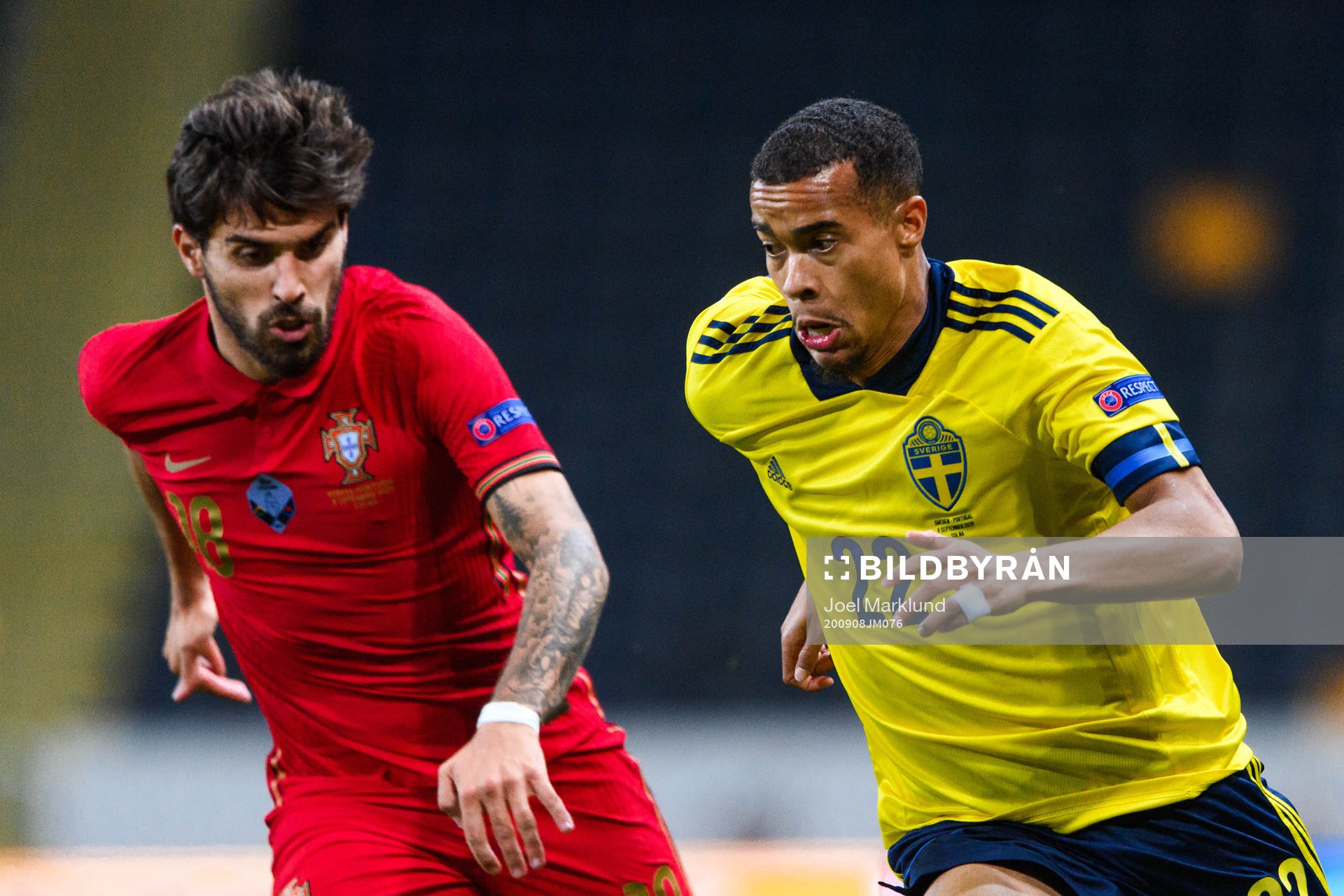 Ruben Neves of Portugal and Robin Quaison of Sweden