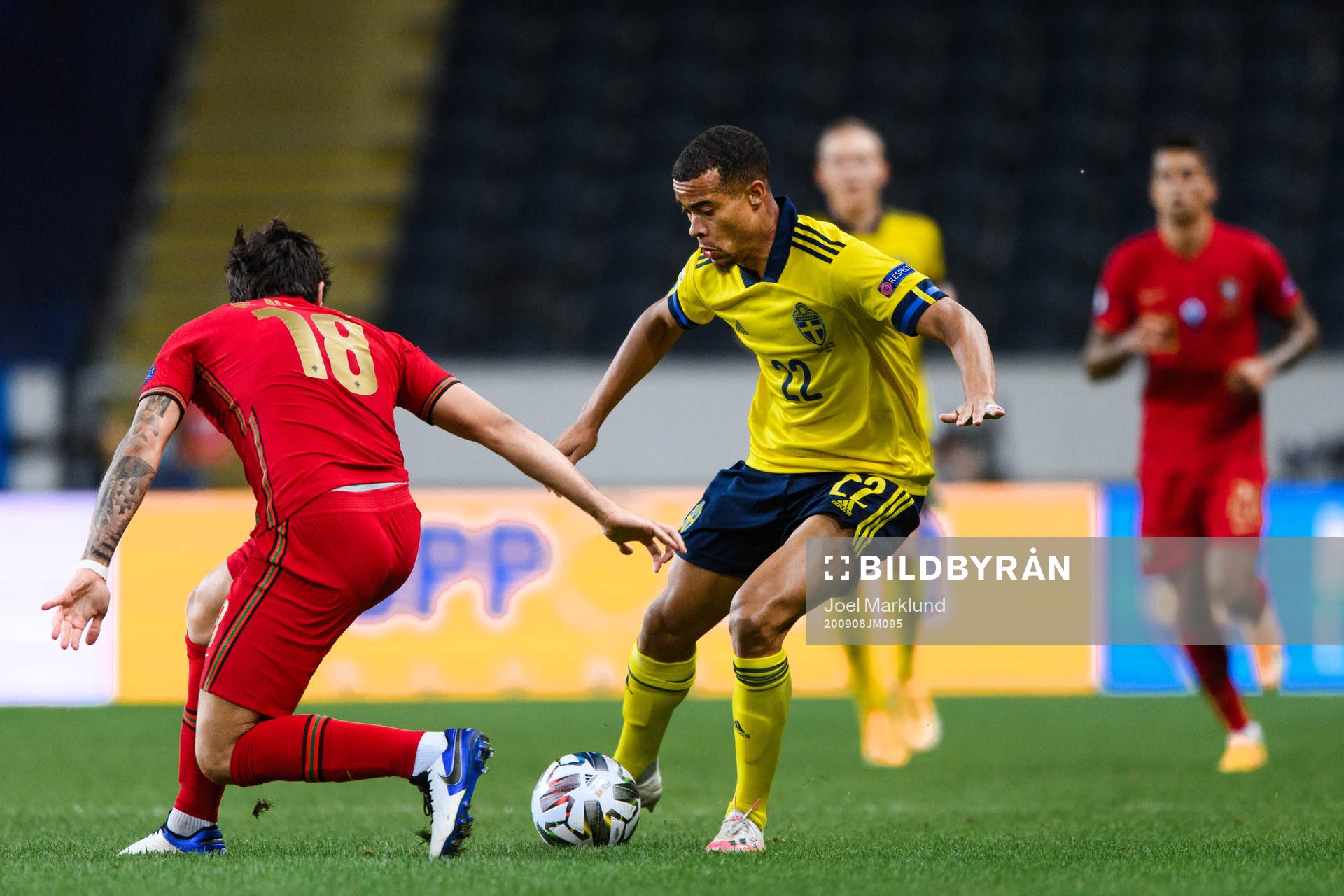 Ruben Neves of Portugal and Robin Quaison of Sweden