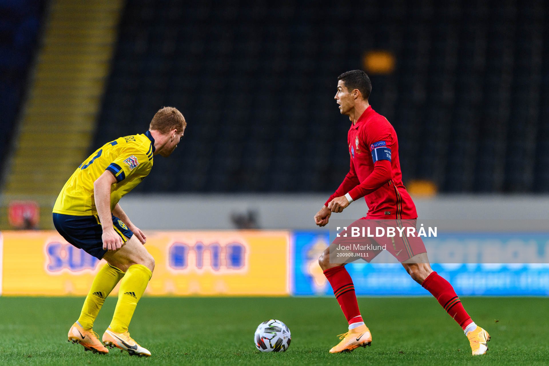 Dejan Kulusevski of Sweden and Cristiano Ronaldo of Portugal