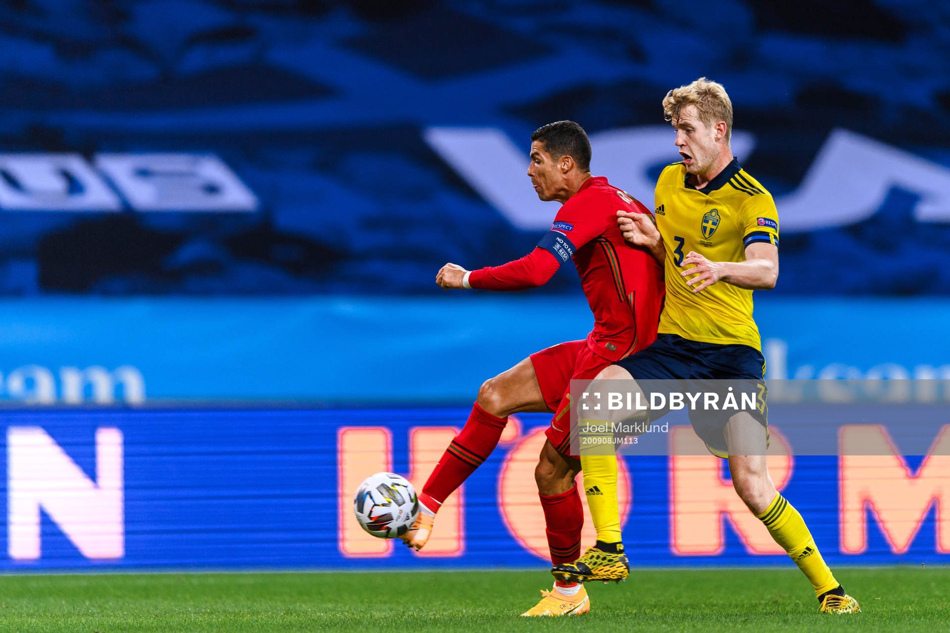 Cristiano Ronaldo of Portugal and Filip Helander of Sweden