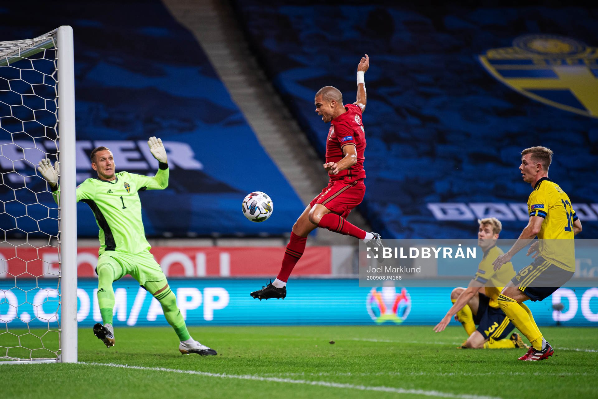 Goalkeeper Robin Olsen and Emil Krafth of Sweden are being