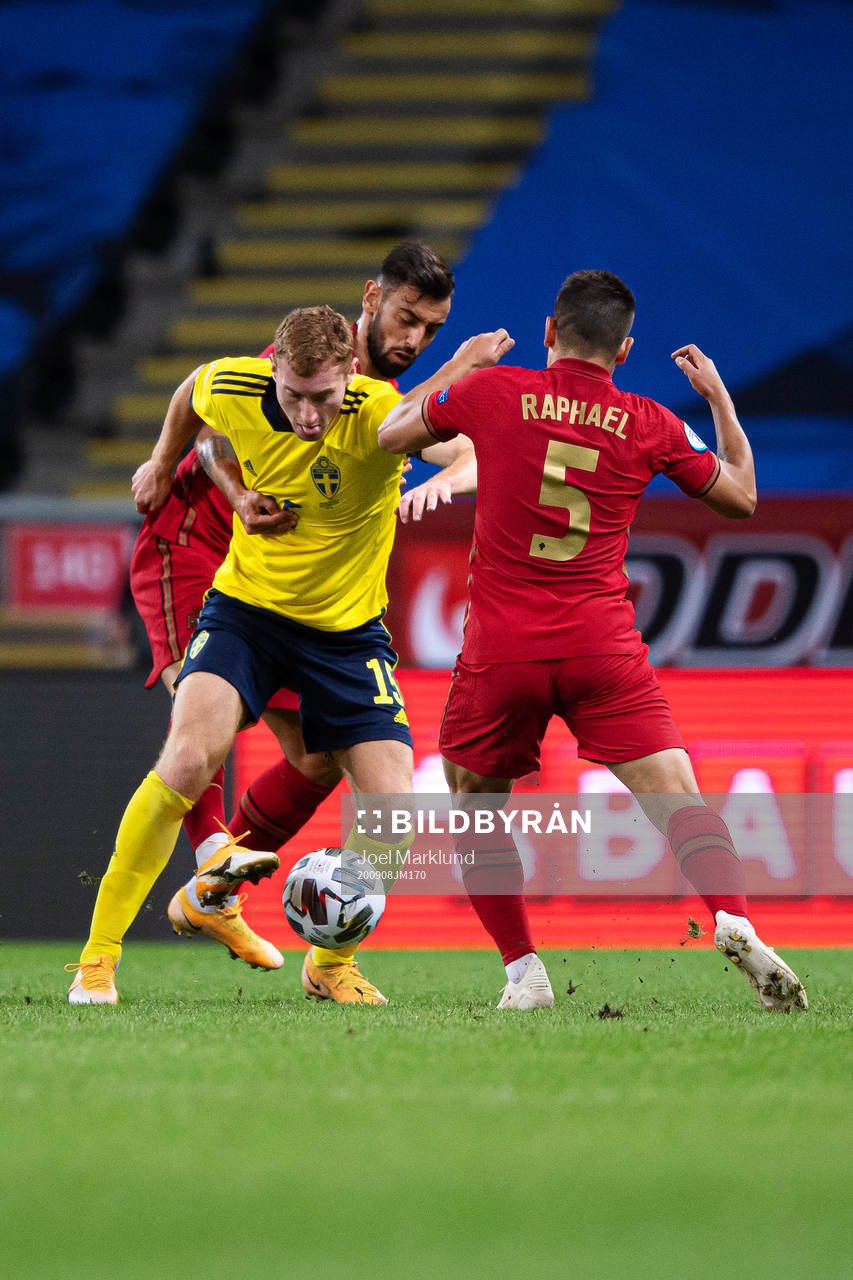 Bruno Fernandes and Raphael Guerreiro of Portugal are being
