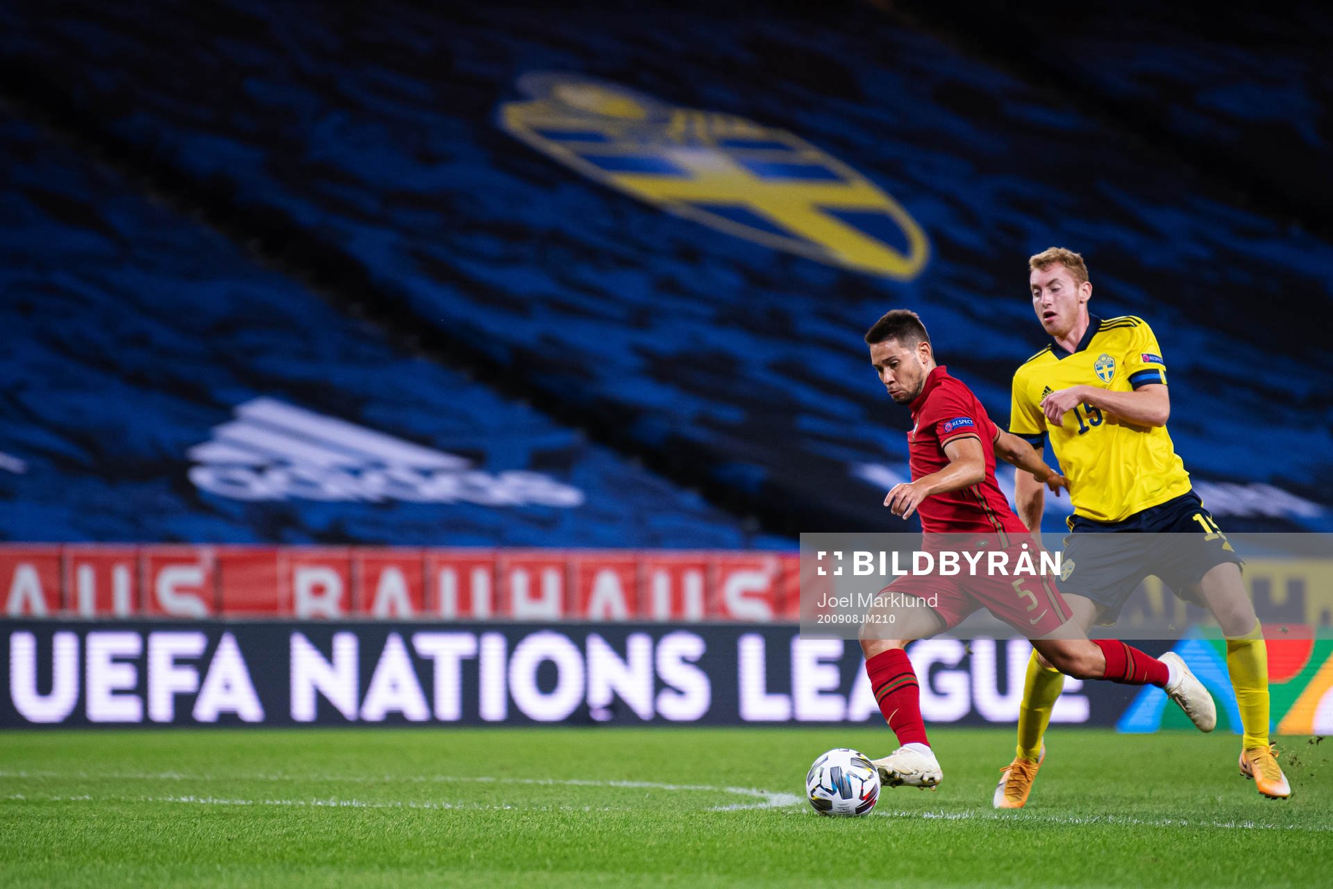 Raphael Guerreiro of Portugal and Dejan Kulusevski of Sweden