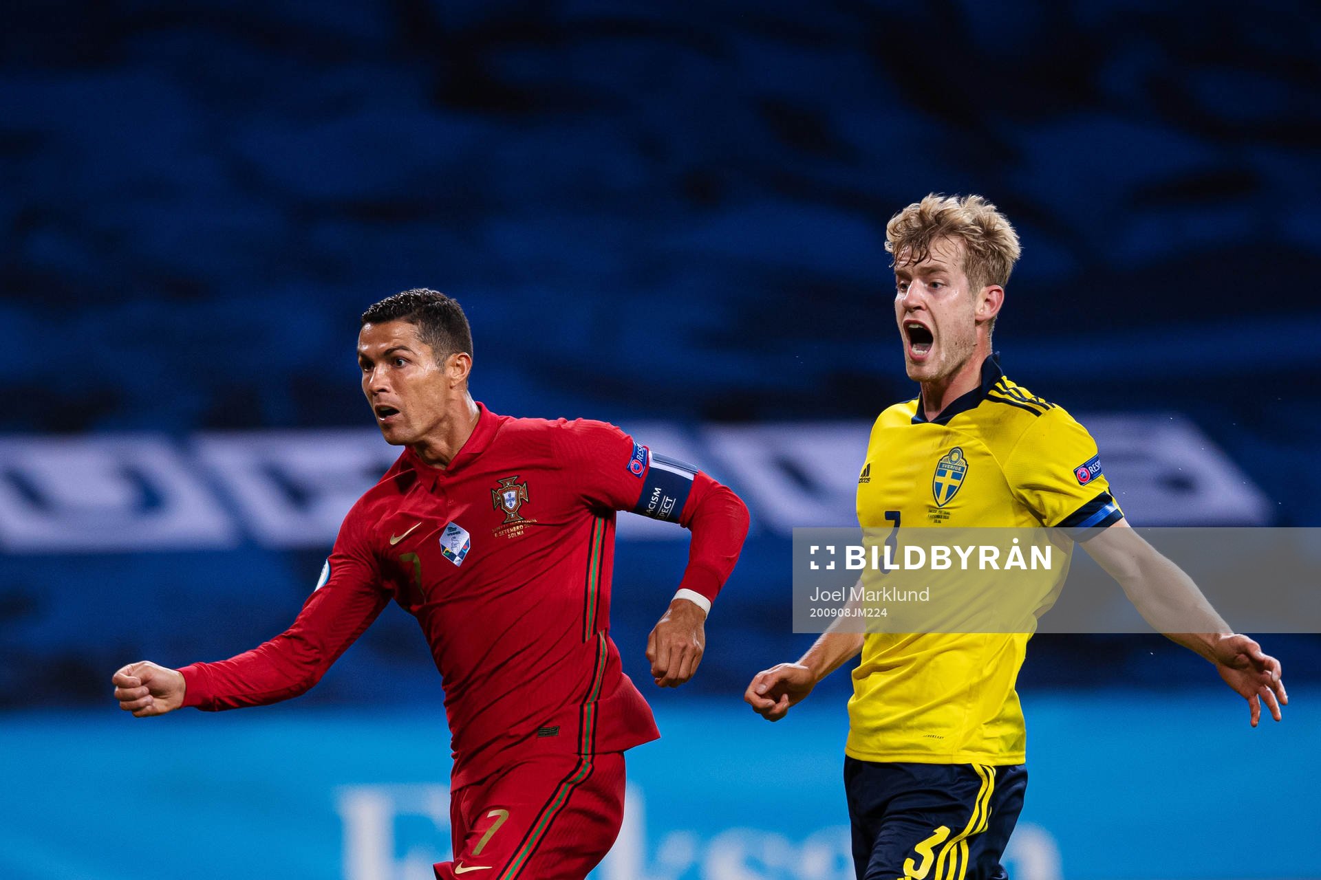 Cristiano Ronaldo of Portugal and Filip Helander of Sweden