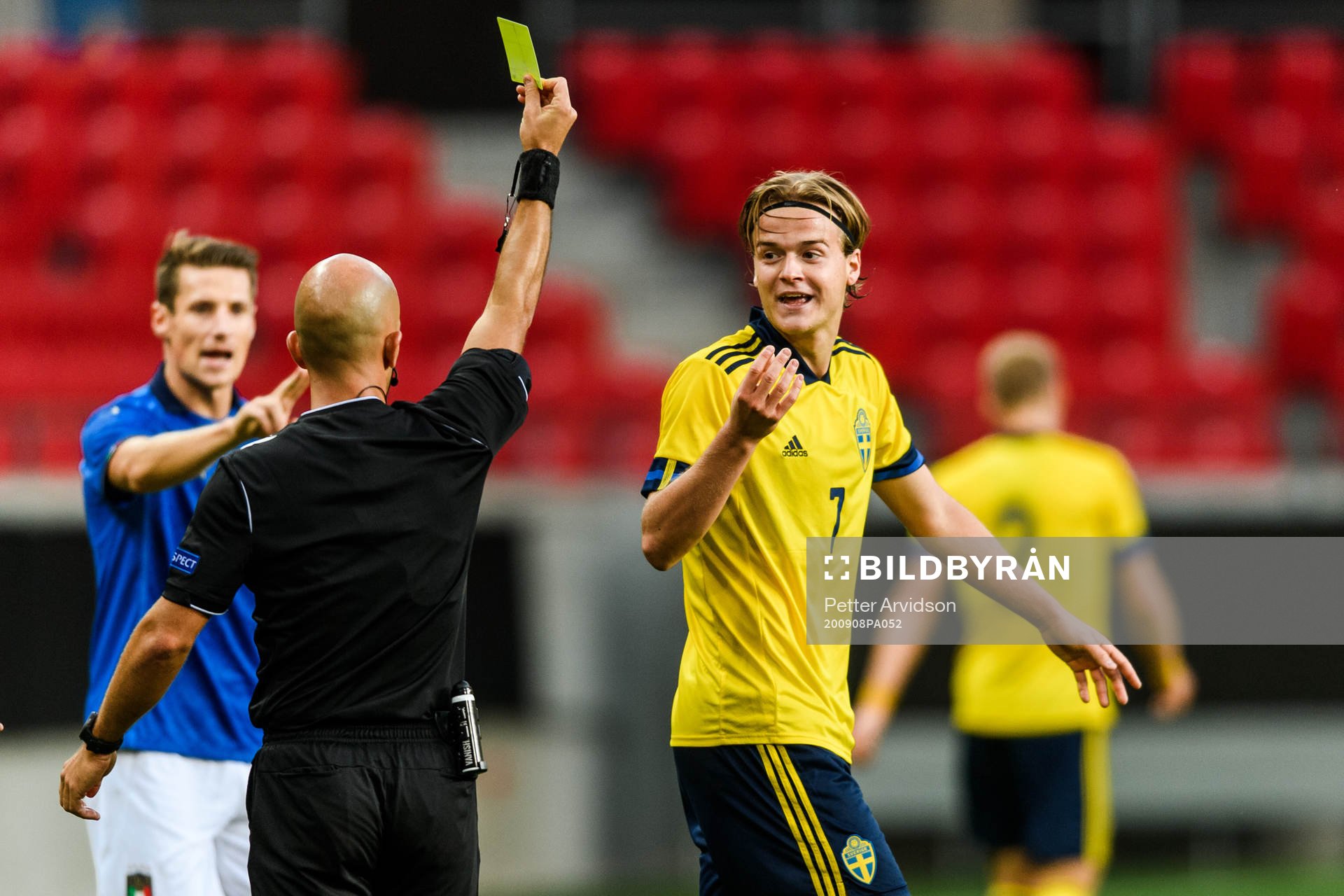 August Erlingmark of Sweden receives a yellow card