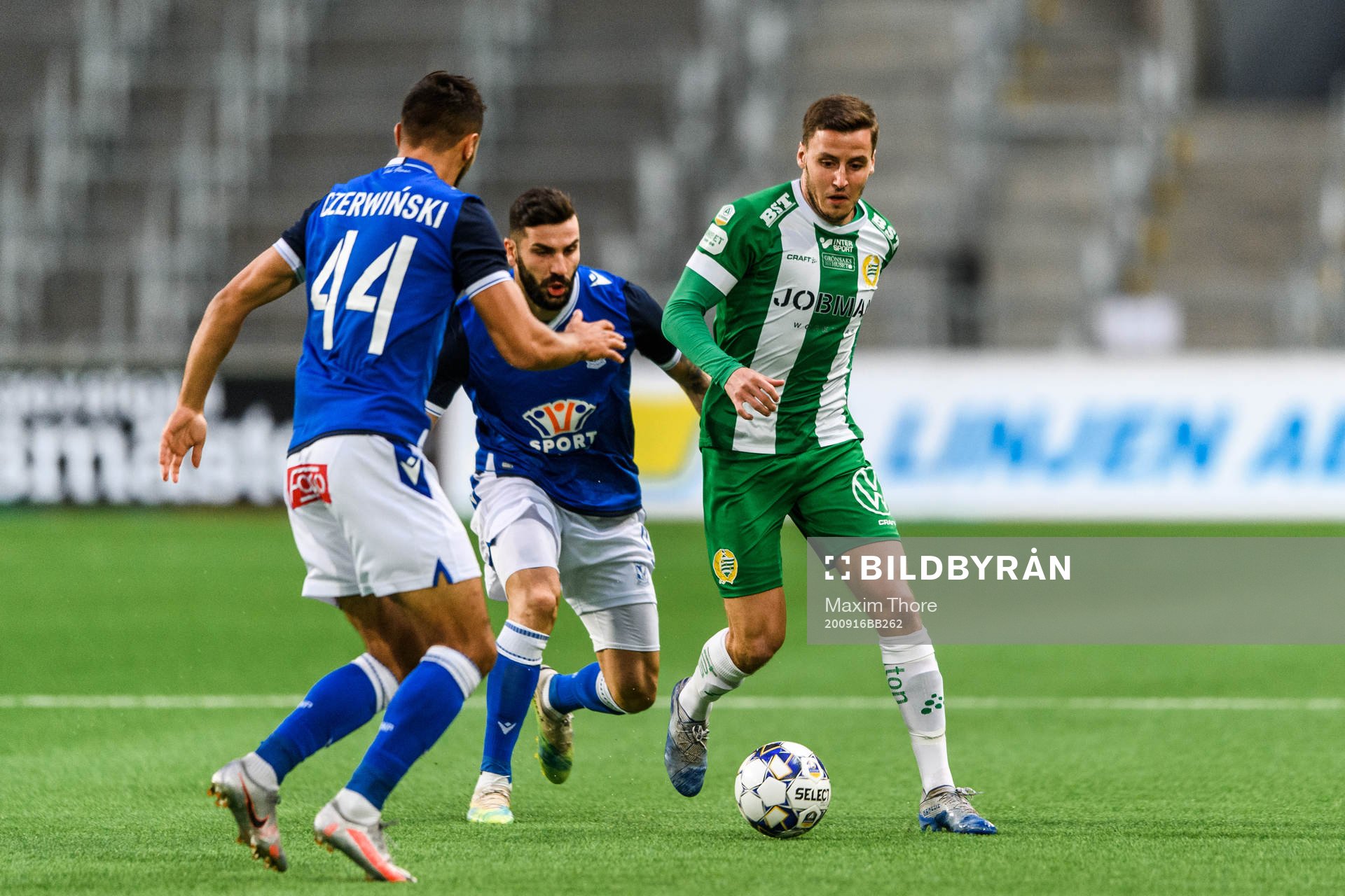 Jeppe Andersen of Hammarby against Alan Czerwinski and