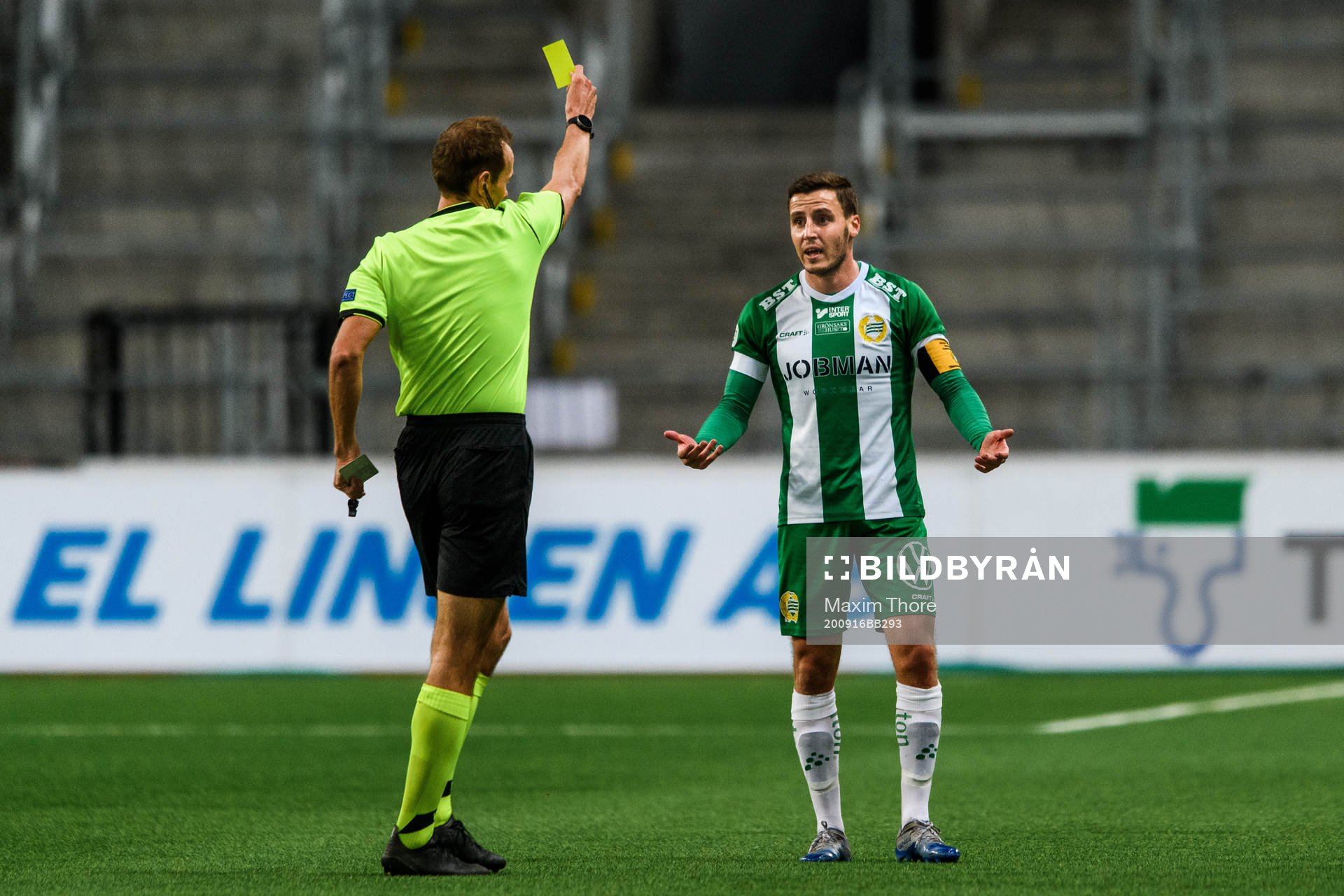 Jeppe Andersen of Hammarby receives a yellow card from