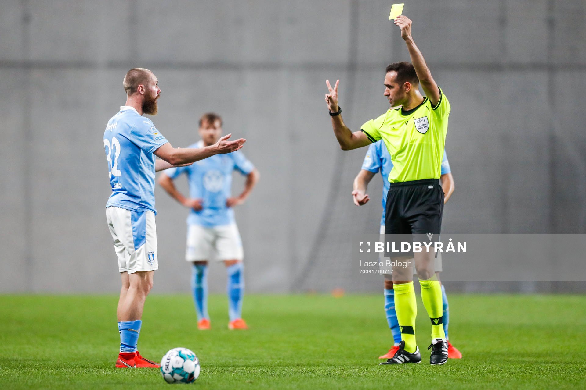 Jo Inge Berget of Malmö FF receives a yellow card
