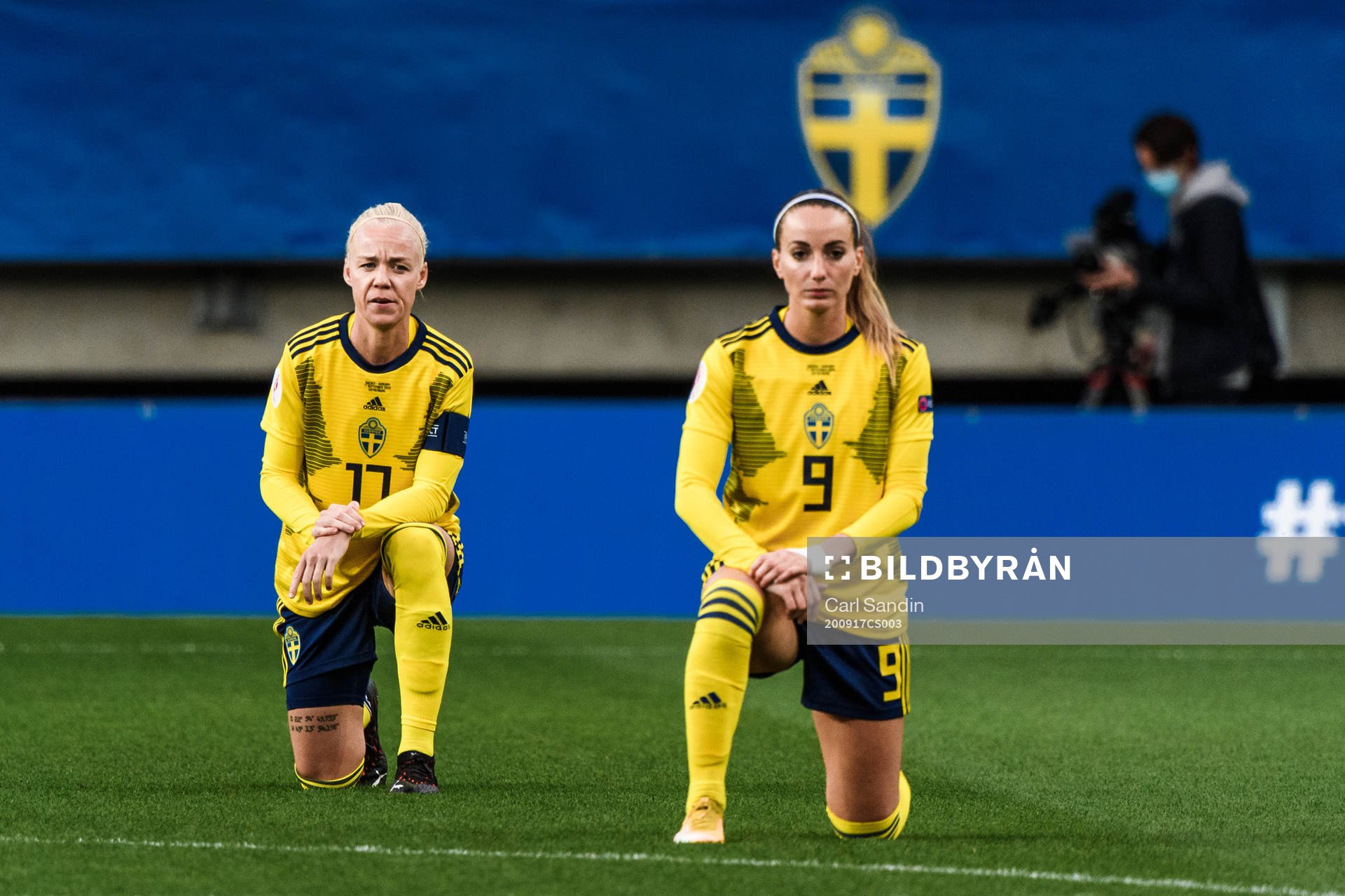 Caroline Seger and Kosovare Asllani of Sweden kneels in