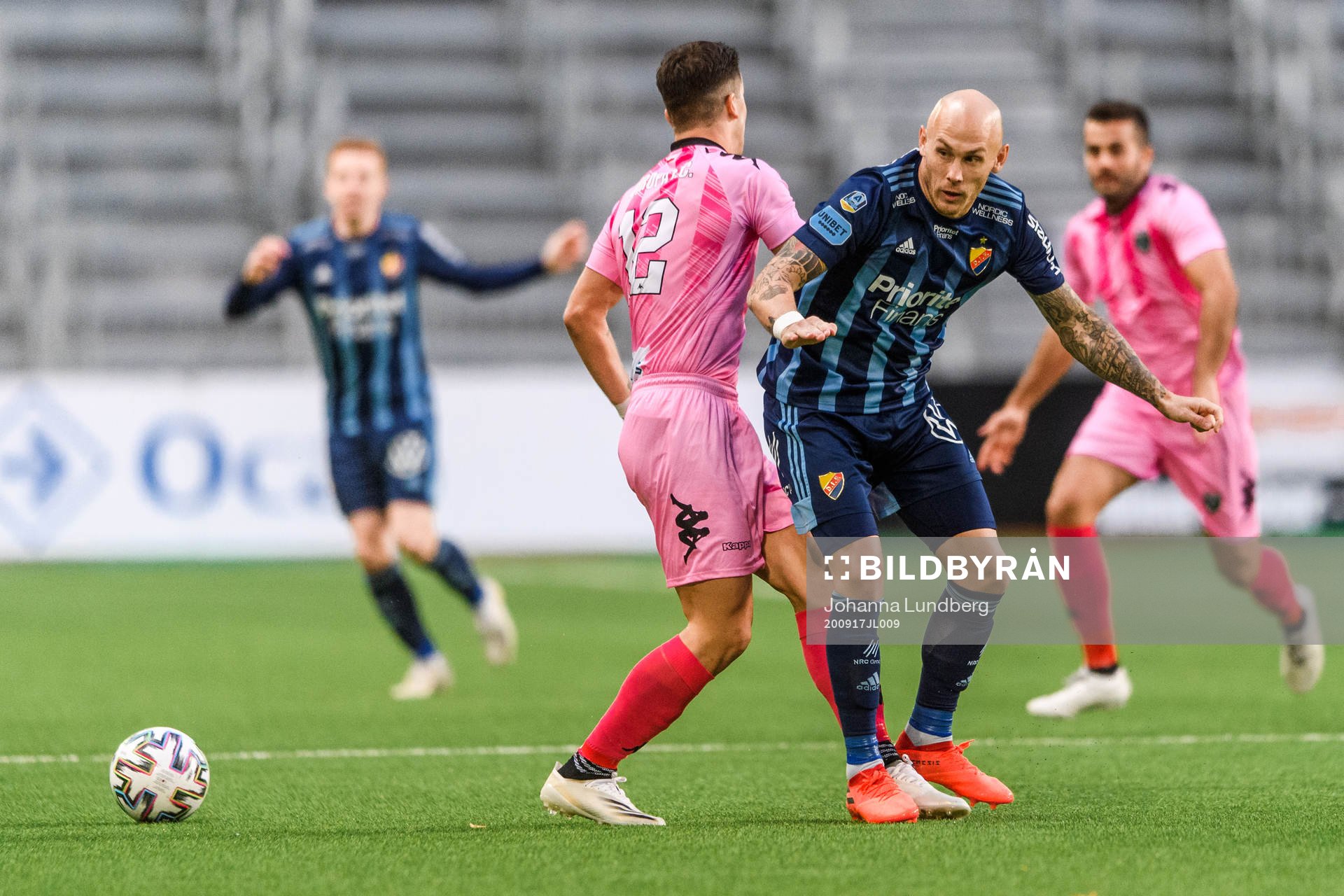 Jayce Olivero of Europa FC and Magnus Eriksson of