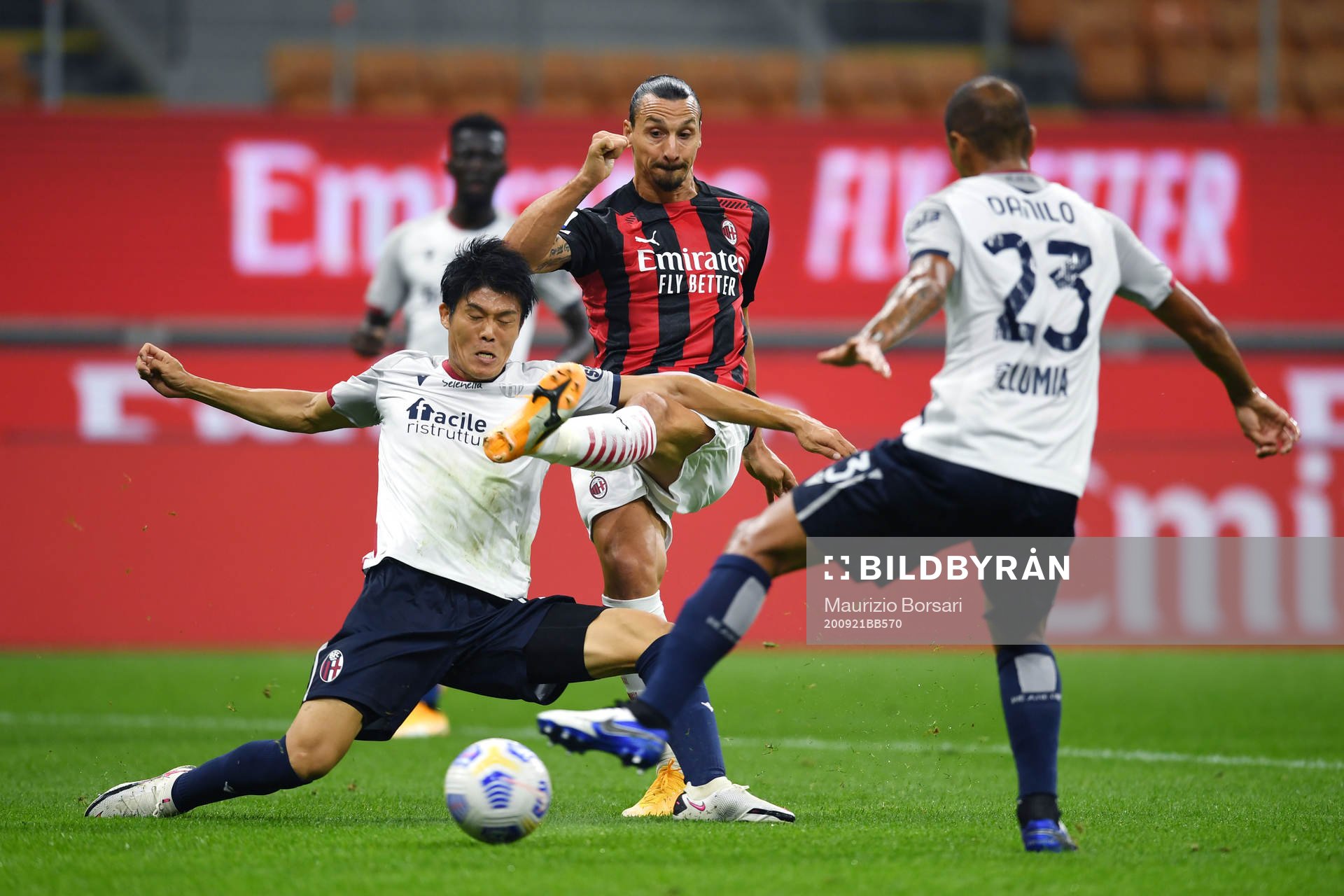 Zlatan Ibrahimovic of AC Milan against Takehiro Tomiyasu of