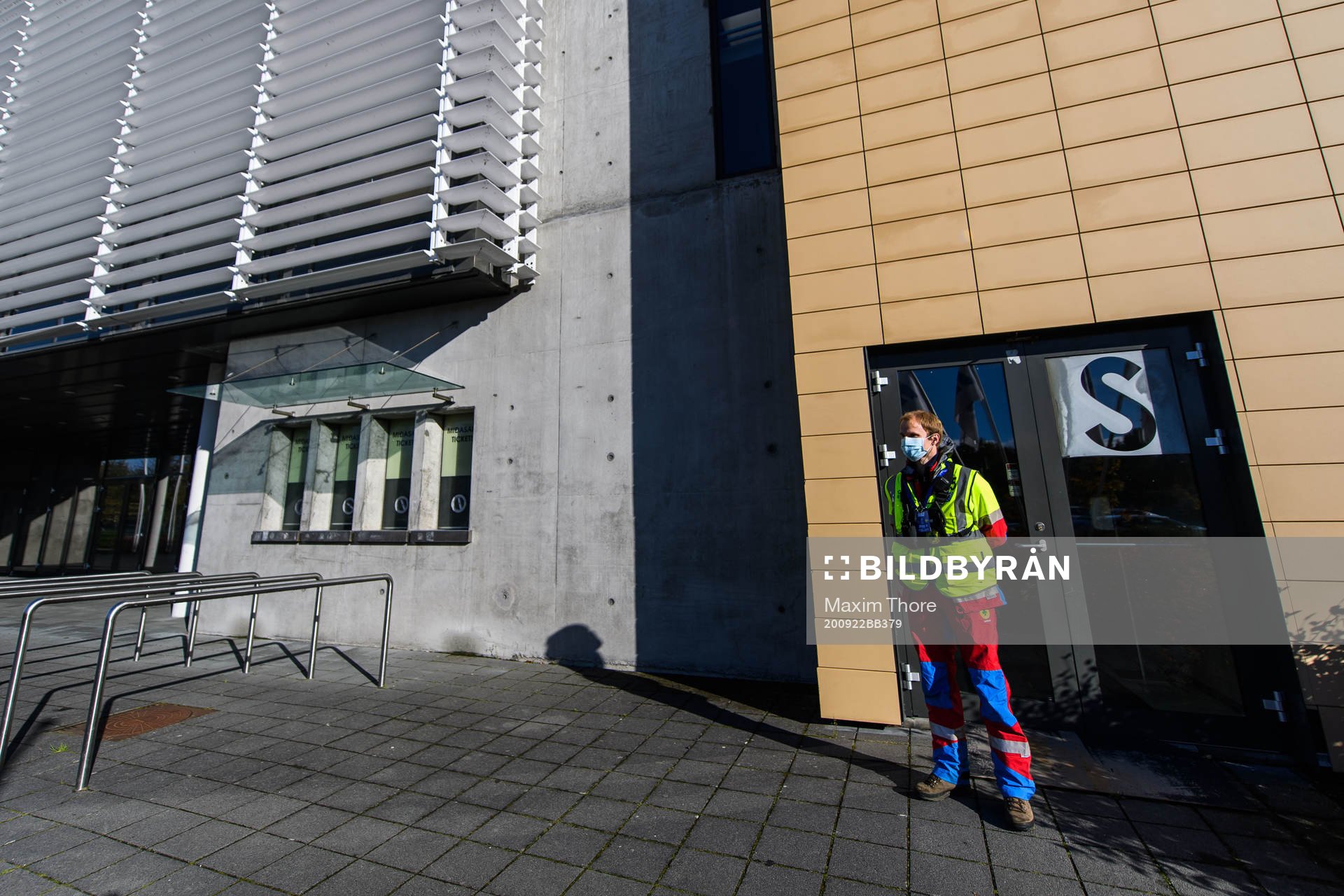 A steward outside Laugardalsvöllur stadium with a face