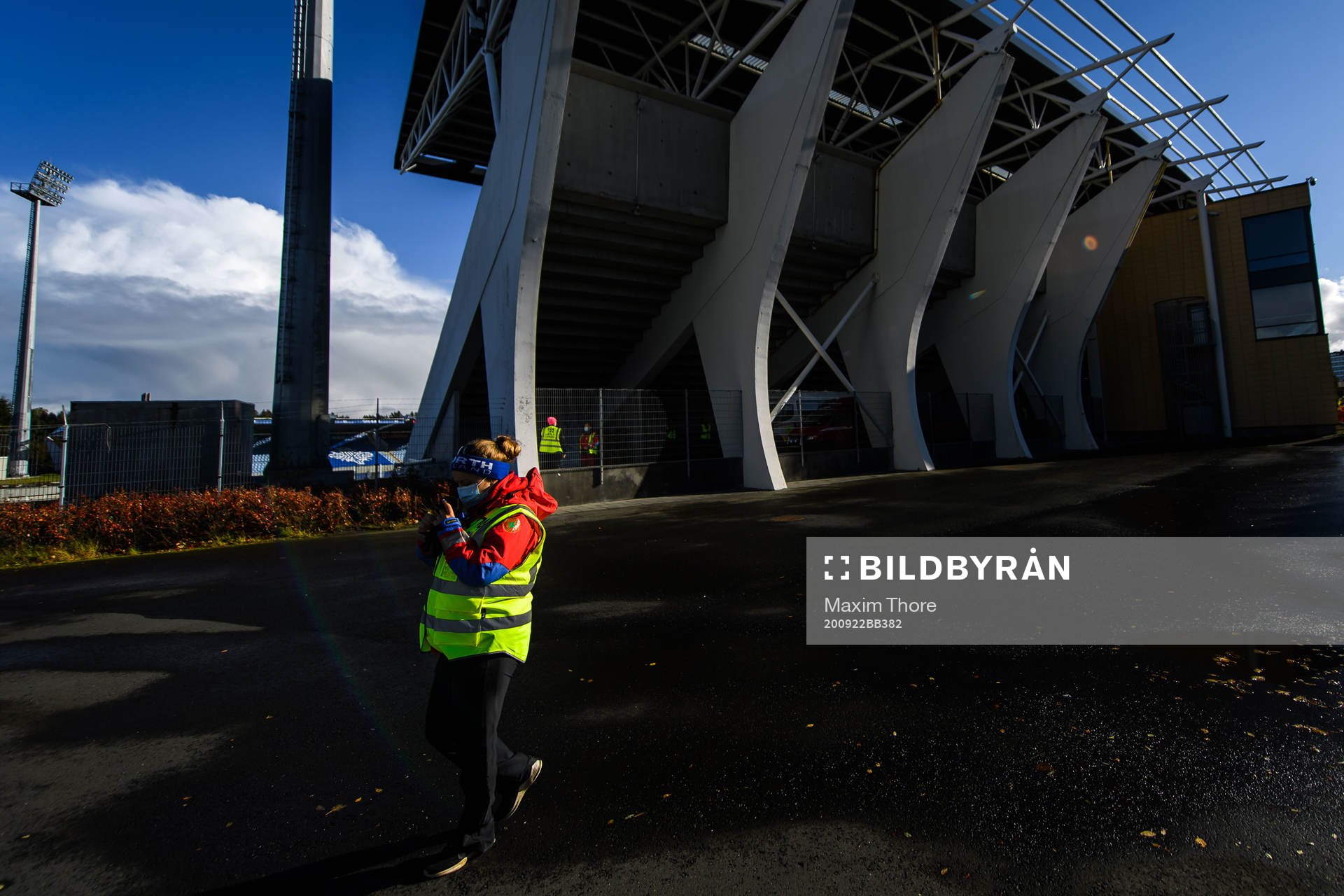 A steward outside Laugardalsvöllur stadium with a face