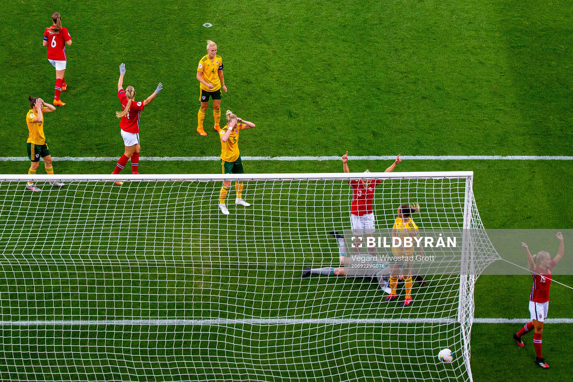 Players of Wales look dejected as goalkeeper Laura