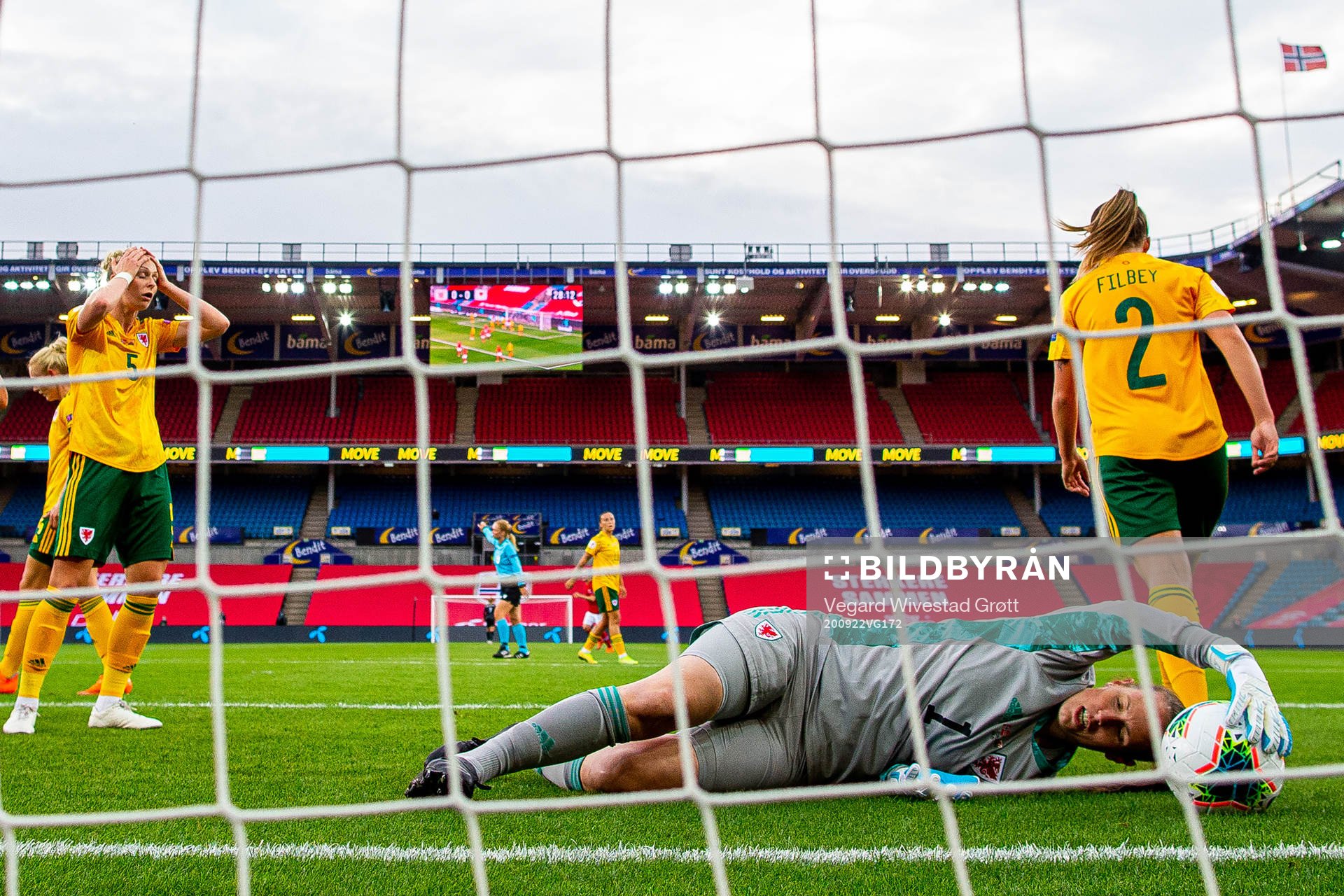 Rhiannon Roberts and goalkeeper Laura O'Sullivan of Wales
