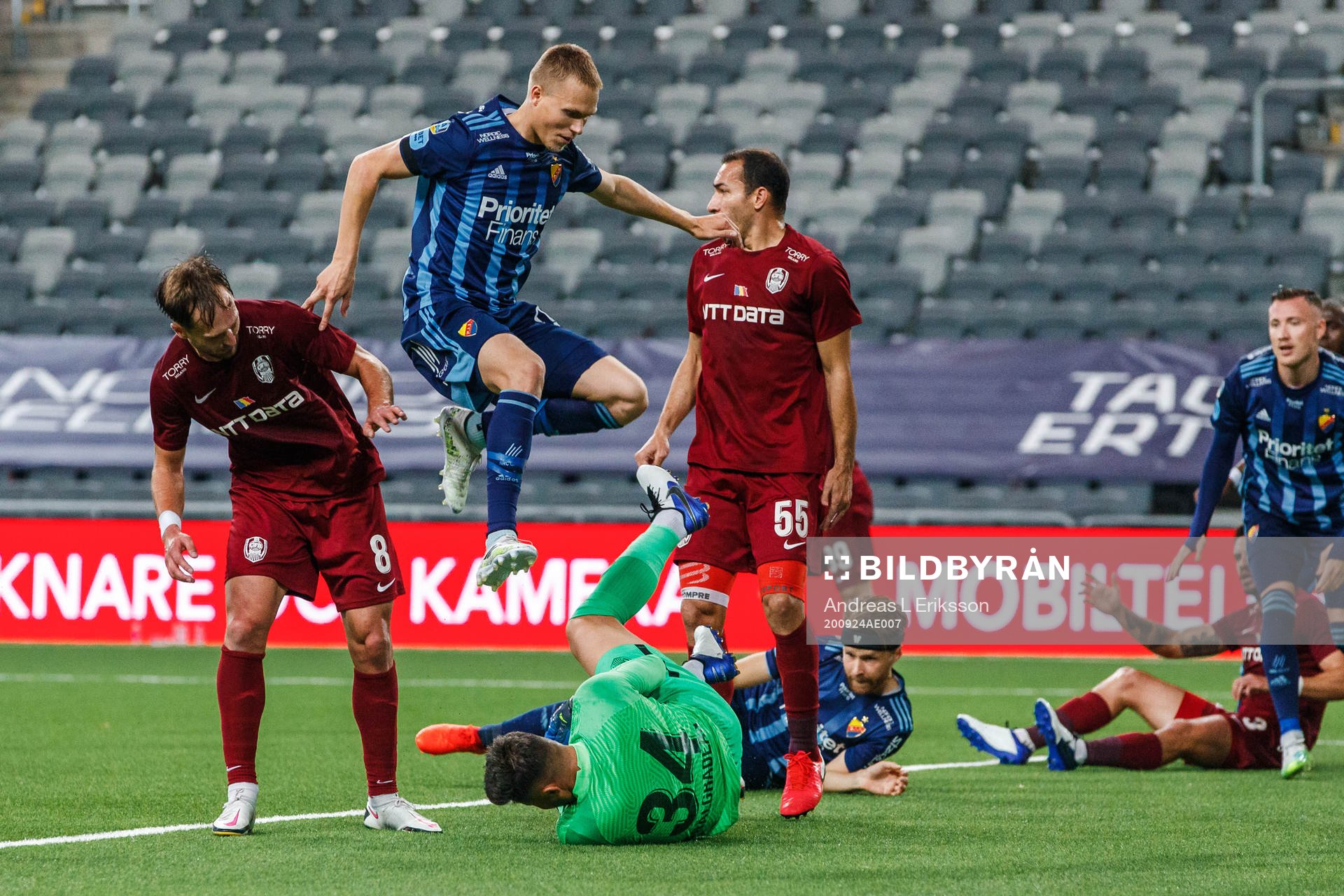 Gaolkeeper Cristian Balgradean of CFR Cluj and Jonathan Augustinsson of Djurgården during the UEFA Europa League qualifying match between Djurgården and CFR Cluj on September 24, 2020 in Stockholm.