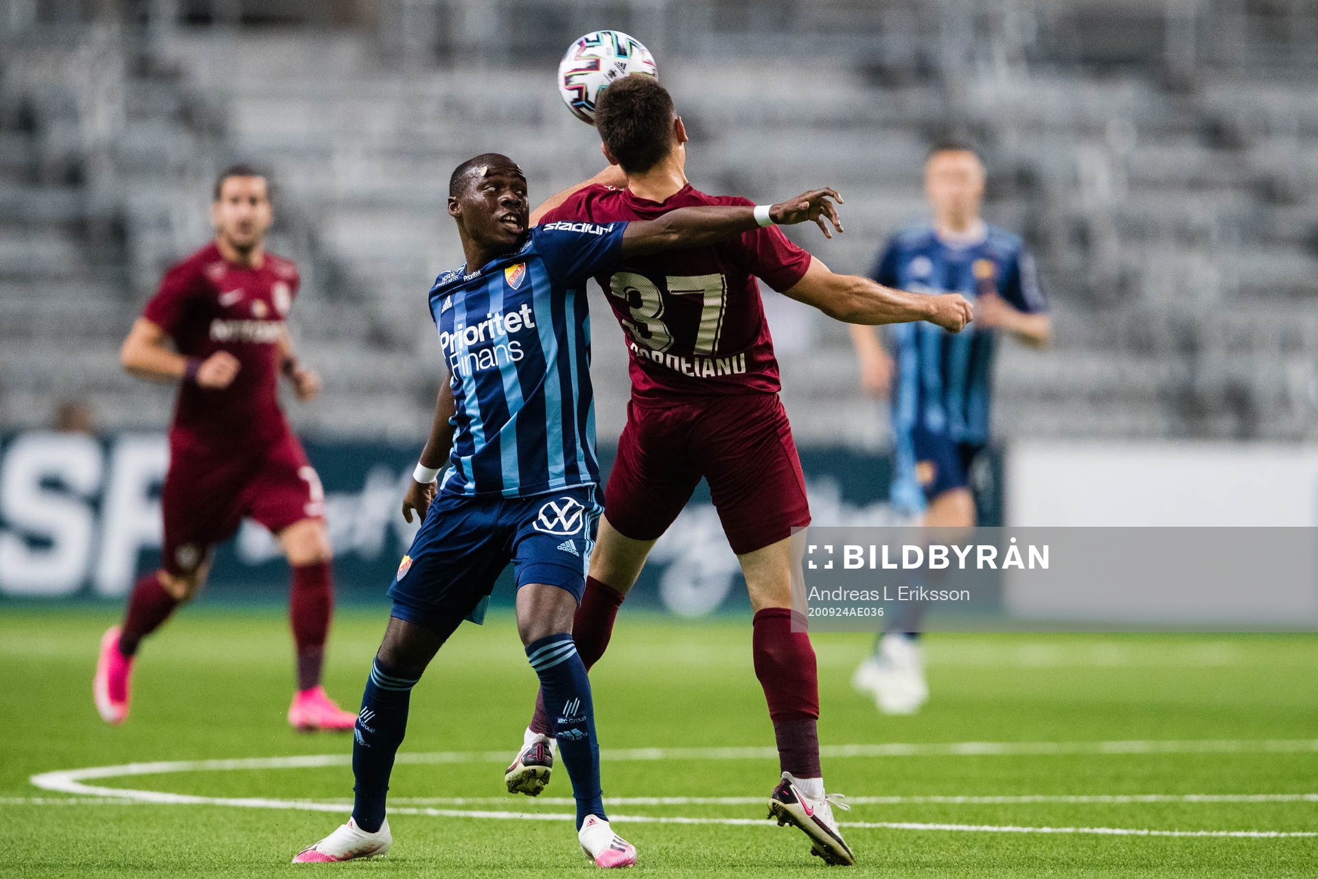 Edward Chilufya of Djurgården and Mihai Bordeianu of CFR Cluj during the UEFA Europa League qualifying match between Djurgården and CFR Cluj on September 24, 2020 in Stockholm.