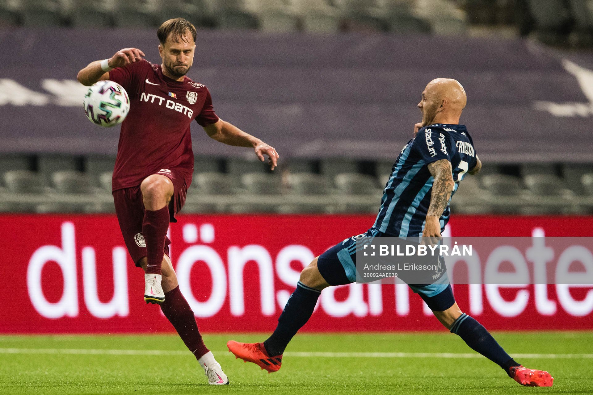 Damjan Dokovic of CFR Cluj and Magnus Eriksson of Djurgården during the UEFA Europa League qualifying match between Djurgården and CFR Cluj on September 24, 2020 in Stockholm.
