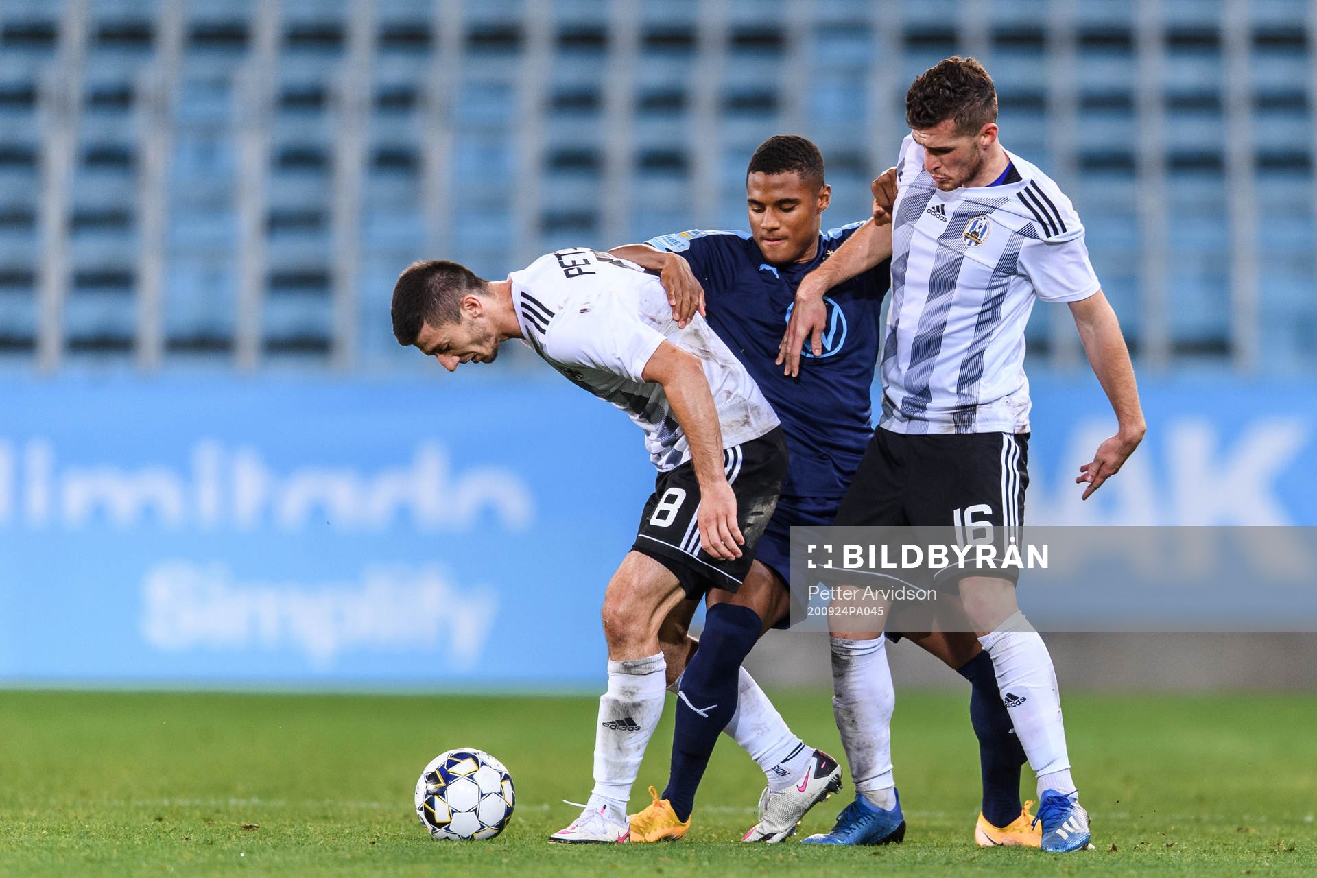 Amin Sarr of Malmö FF against Oliver Petrak and Jon