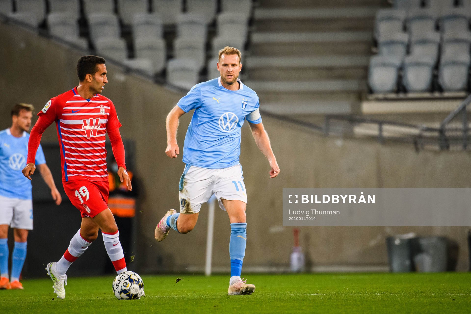 Angel Montoro of Granada and Ola Toivonen of Malmö FF