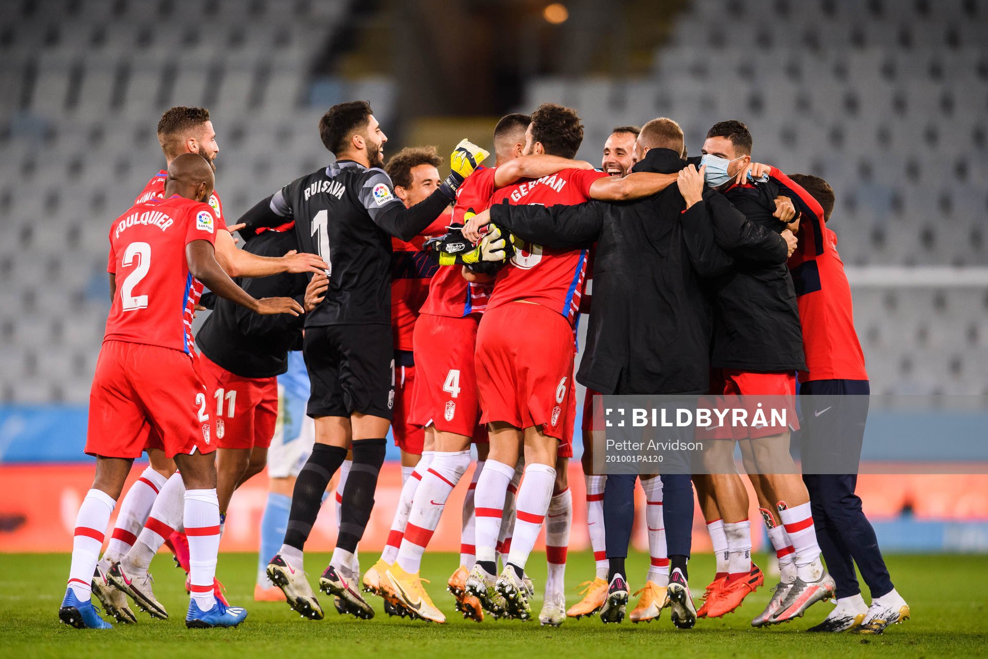 Players of Granada celebrate