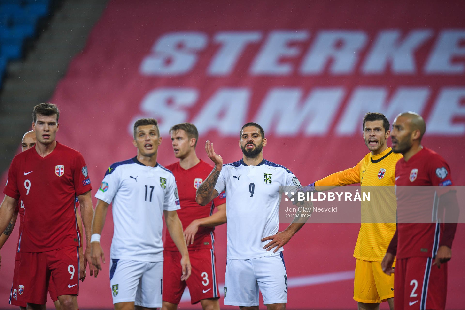 Darko Lazovic and Aleksandar Mitrovic of Serbia against
