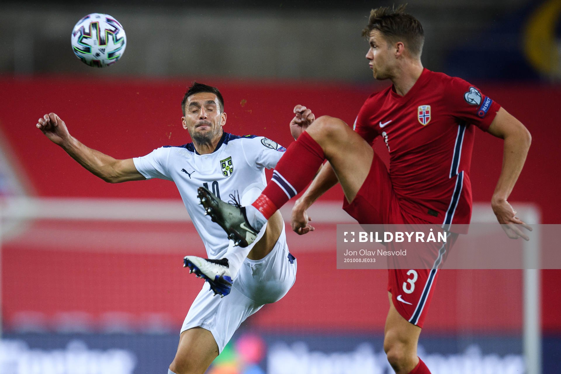 Dusan Tadic of Serbia and Kristoffer Ajer of Norway