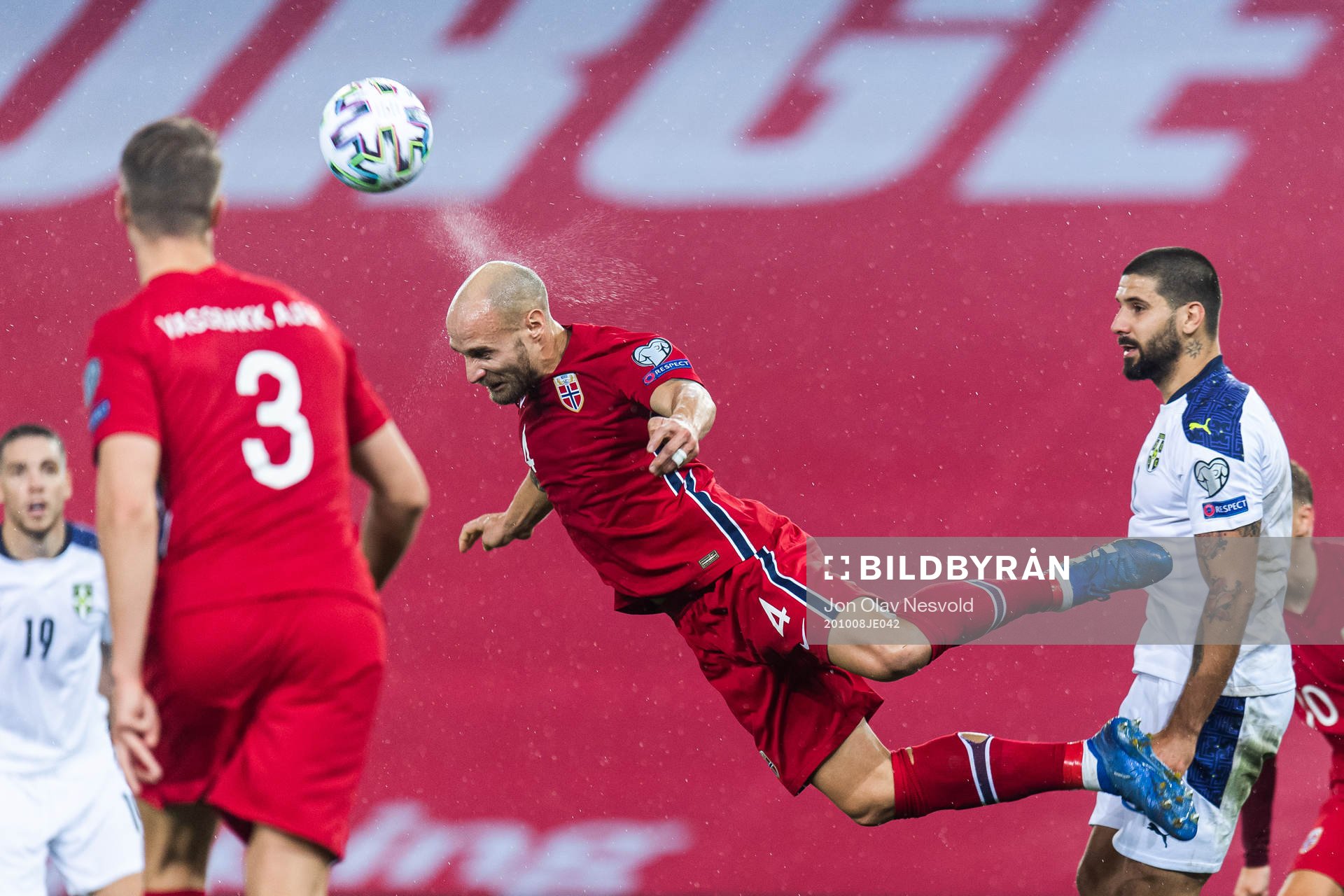 Tore Reginiussen of Norway and Aleksandar Mitrovic of Serbia