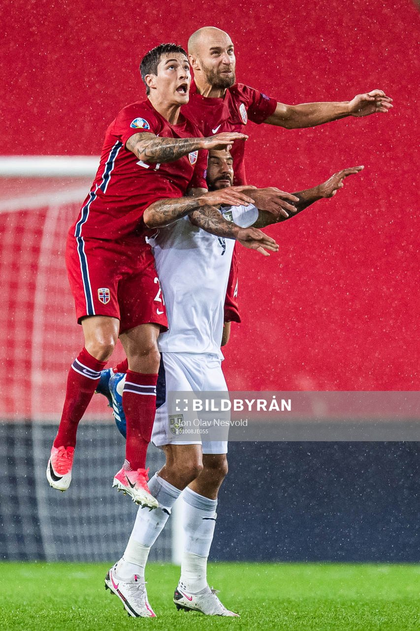 Mathias Normann and Tore Reginiussen of Norway with Aleksandar Mitrovic of Serbia during the UEFA Euro Qualifier play-off semi-final football match between Norway and Serbia on October 8, 2020 in Oslo.
