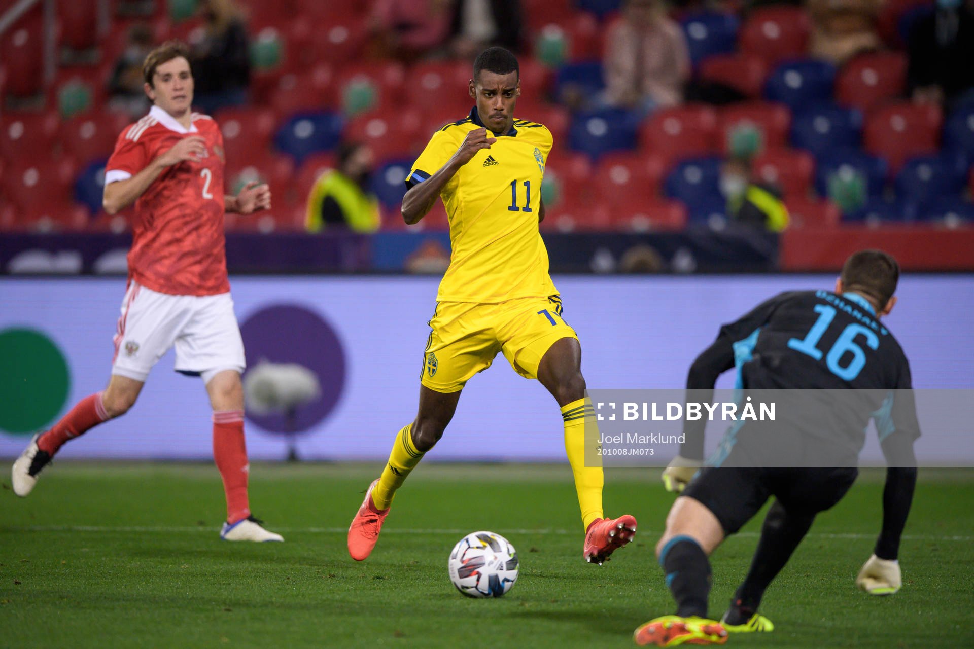 Alexander Isak of Sweden and goalkeeper Soslan Dzhanaev of