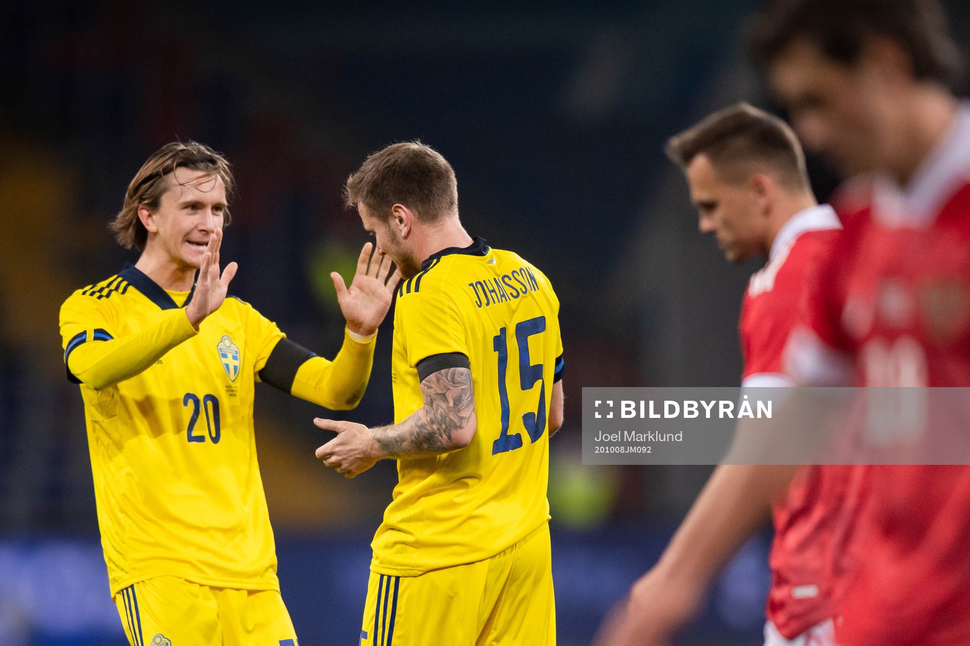 Kristoffer Olsson and Mattias Johansson of Sweden celebrate the 0-2 goal during the international friendly football match between Russia and Sweden on October 8, 2020 in Moscow.