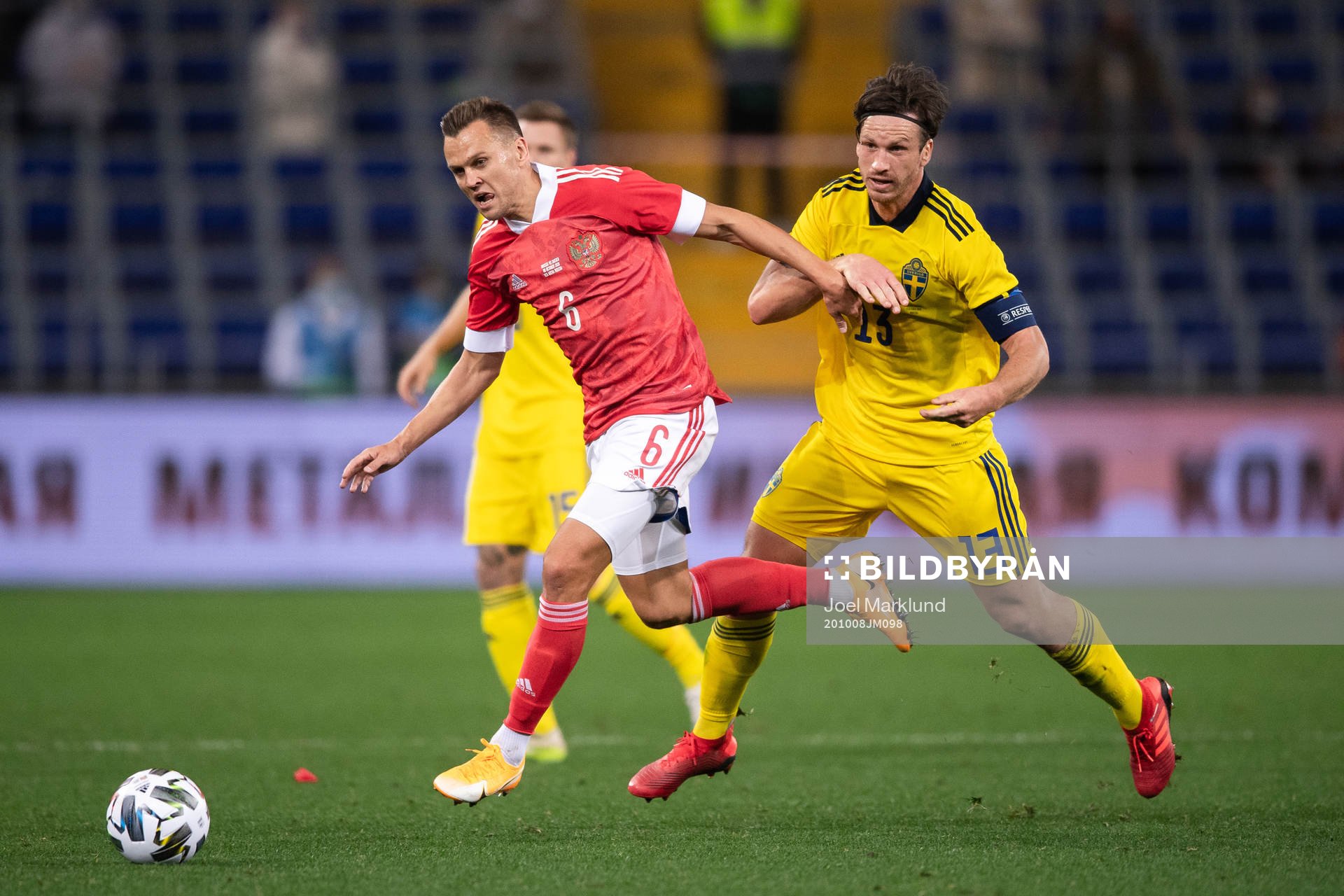 Denis Cheryshev of Russia and Gustav Svensson of Sweden