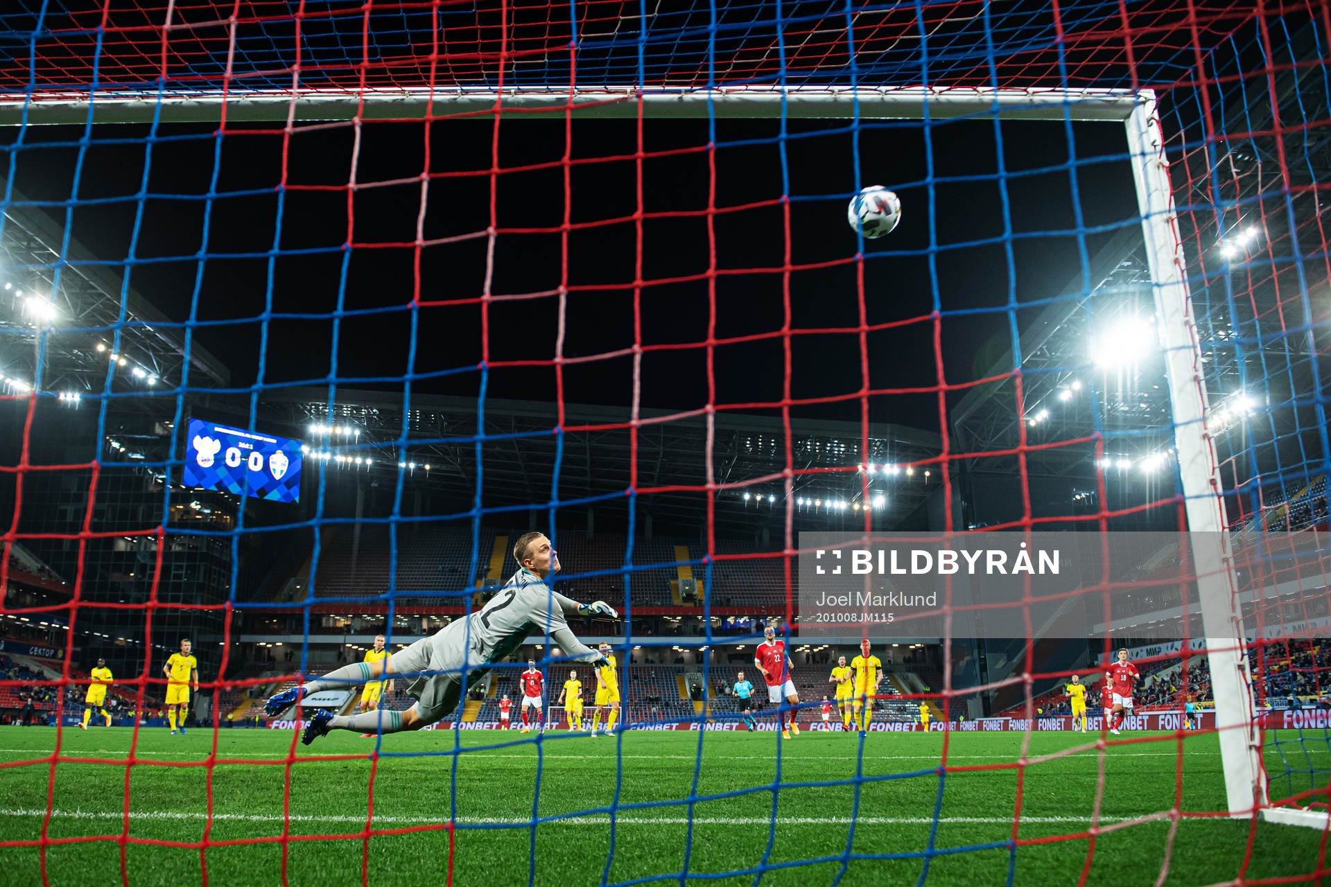 Goalkeeper Karl-Johan Johnsson of Sweden sees the ball hit