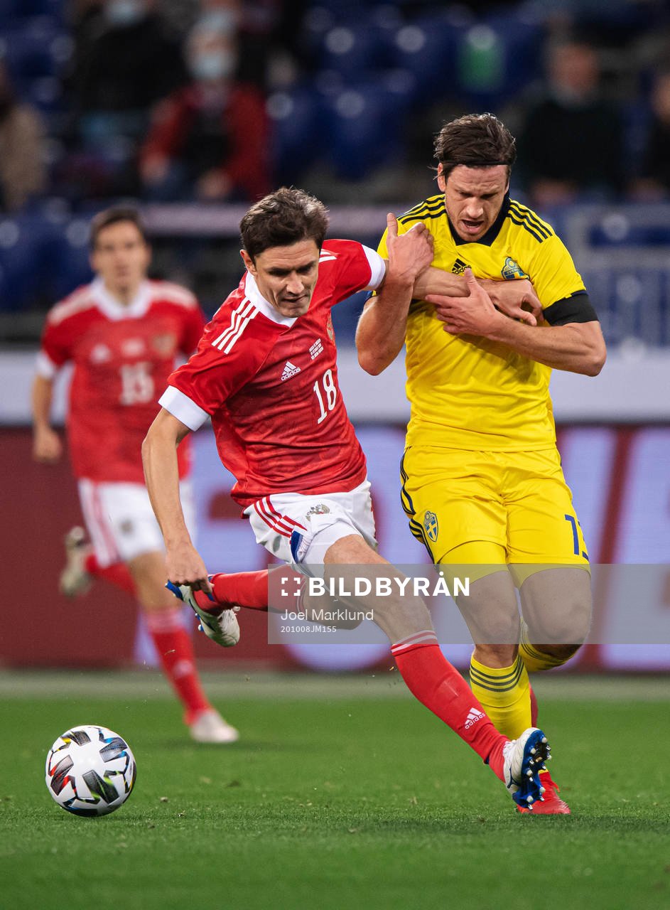 Yuri Zhirkov of Russia in action against Gustav Svensson of Sweden during the international friendly football match between Russia and Sweden on October 8, 2020 in Moscow.