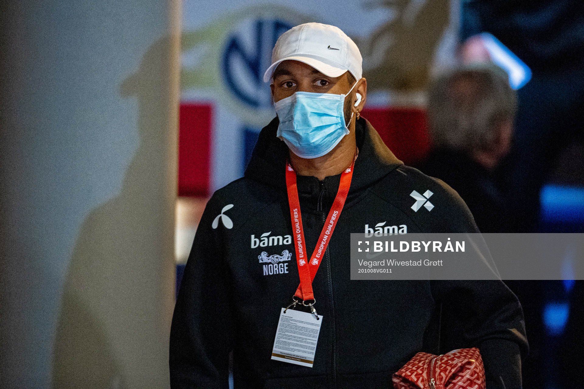 Joshua King of Norway arrives wearing a face mask
