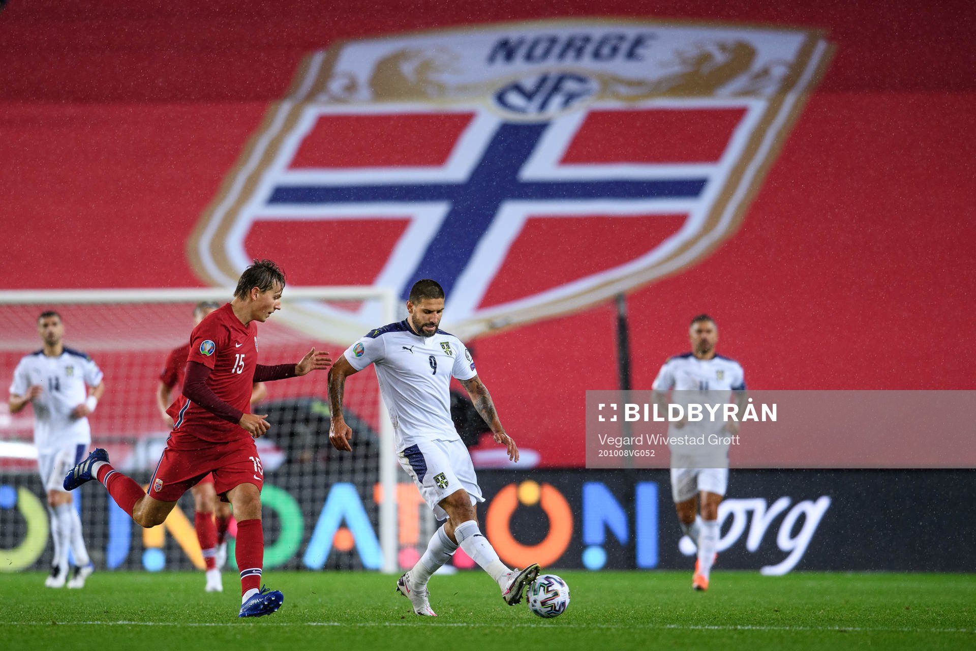 Sander Berge of Norway and Aleksandar Mitrovic of Serbia