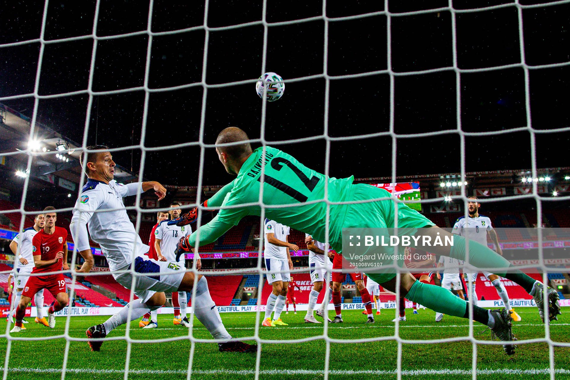 Nemanja Maksimovic and goalkeeper Predrag Rajkovic of