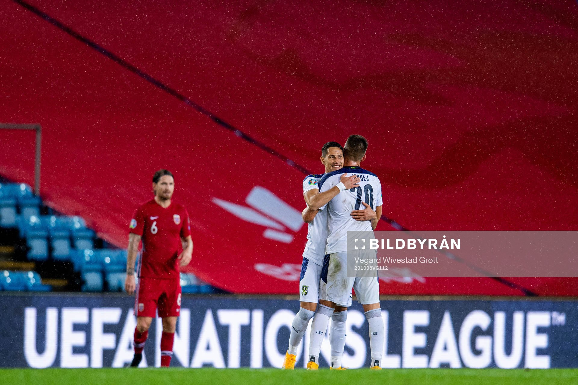Sasa Lukic and Sergej Milinkovic-Savic of Serbia celebrate