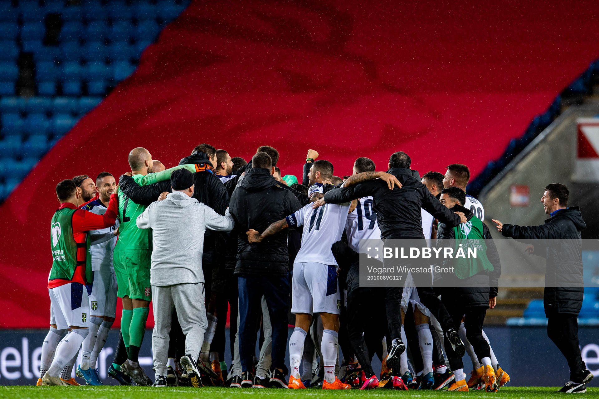 Aleksandar Kolarov and players of Serbia celebrate