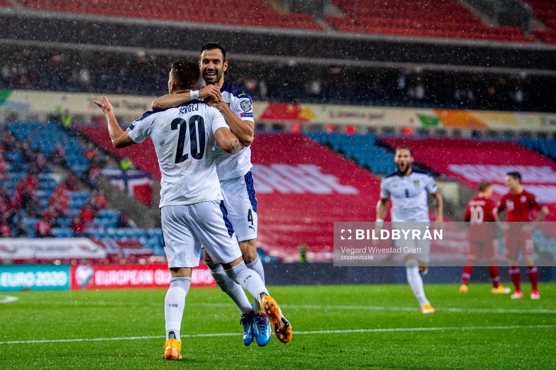 Sergej Milinkovic-Savic of Serbia celebrates with teammate