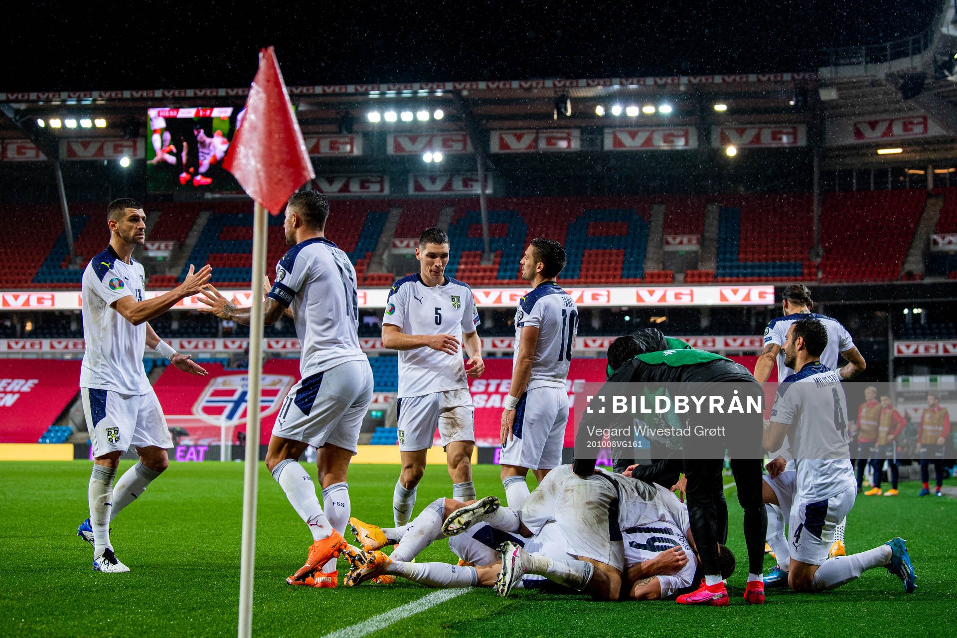 Sergej Milinkovic-Savic of Serbia celebrates with teammates