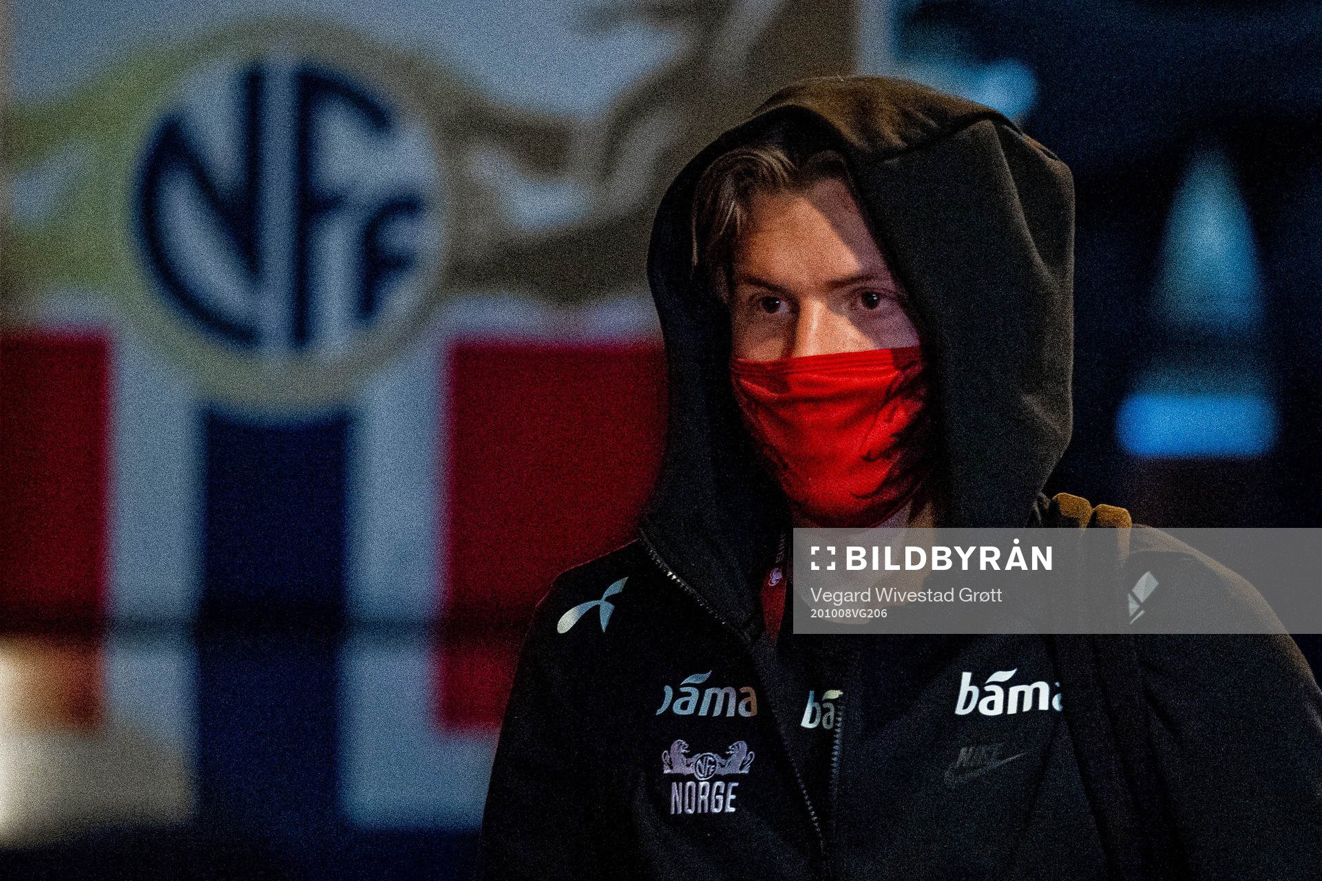 Jens Petter Hauge of Norway arrives wearing a face mask