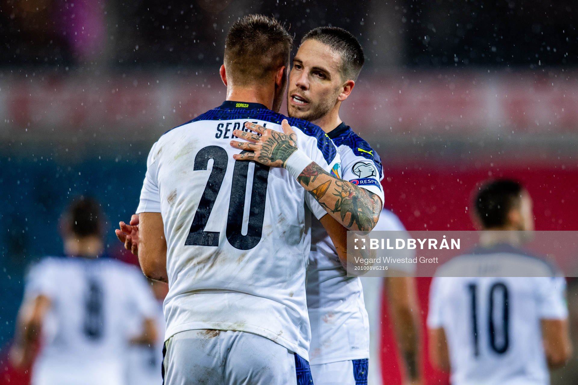 Sergej Milinkovic-Savic of Serbia celebrates with teammate