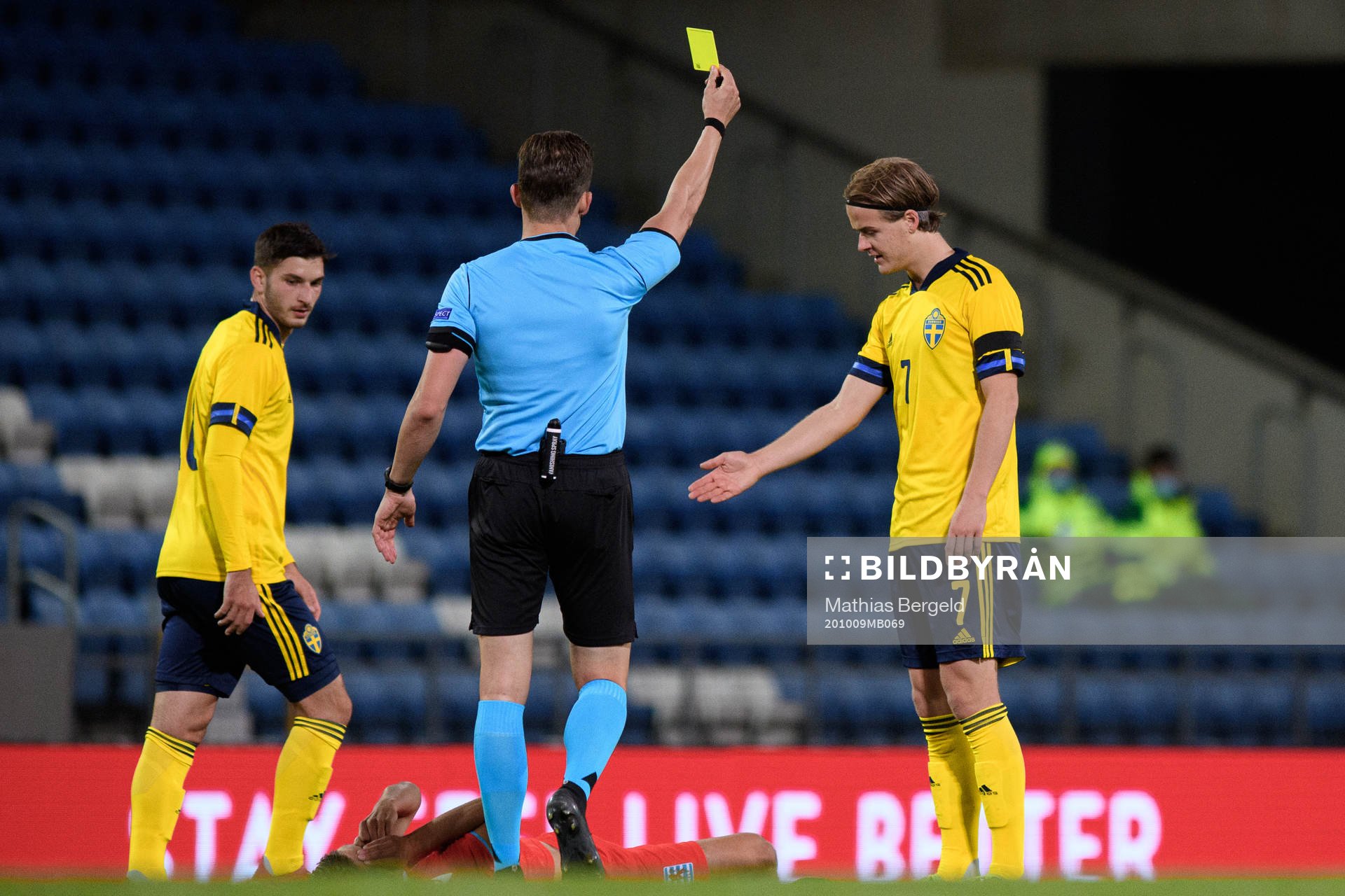 August Erlingmark of Sweden receives a yellow card