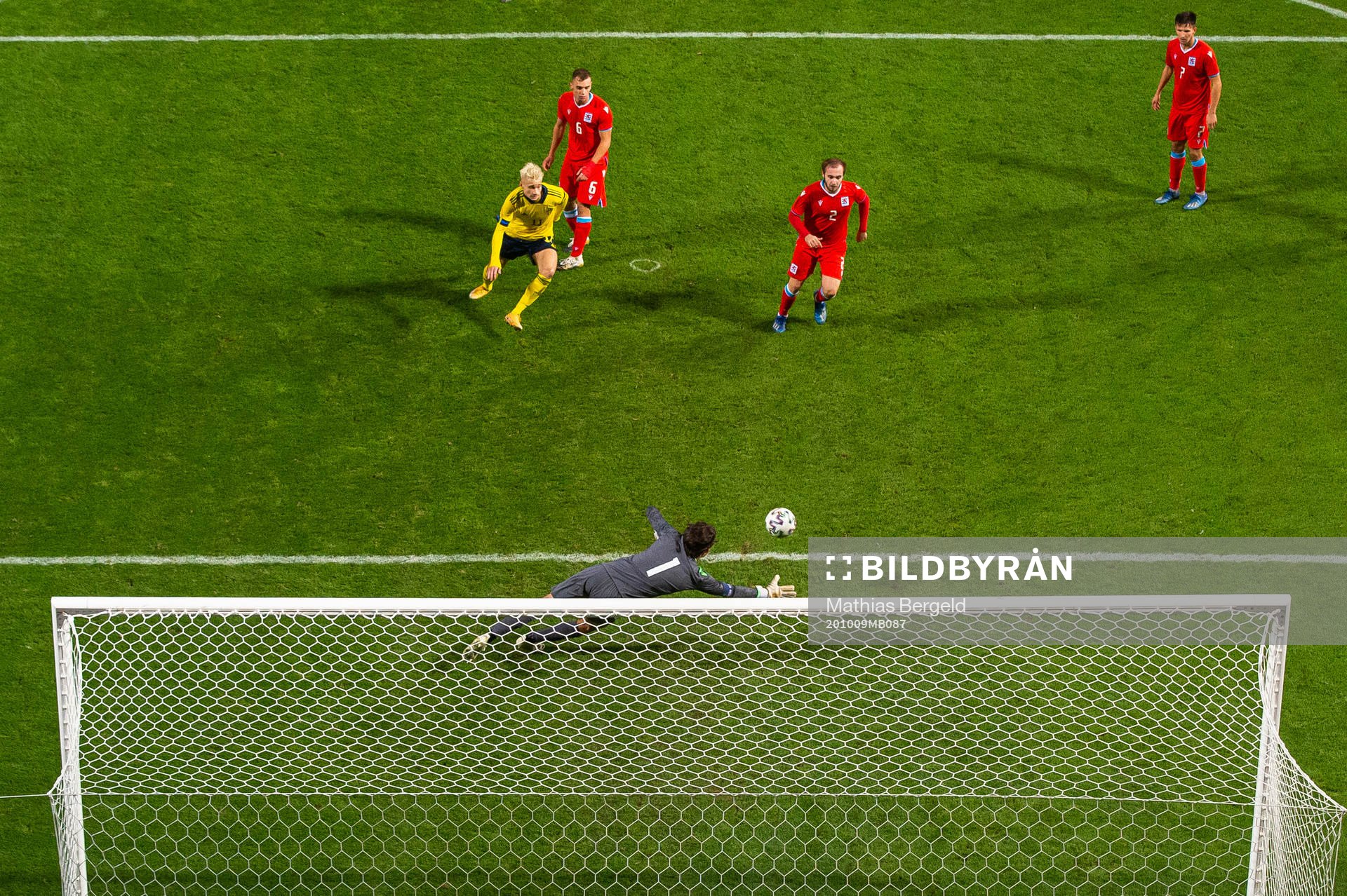 Pontus Almqvist of Sweden sees goalkeeper Tom Ottele of