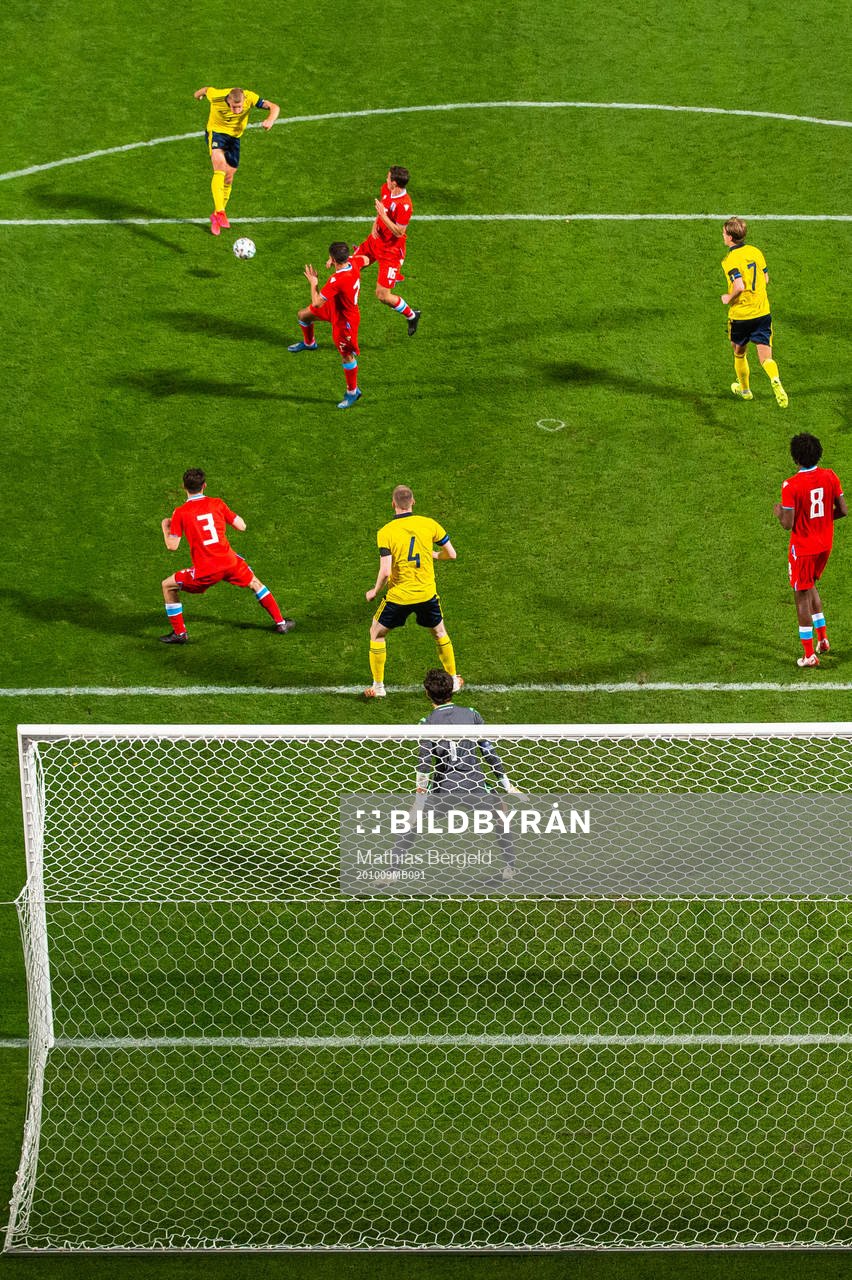 Felix Beijmo of Sweden scores 4-0 behind goalkeeper Tom